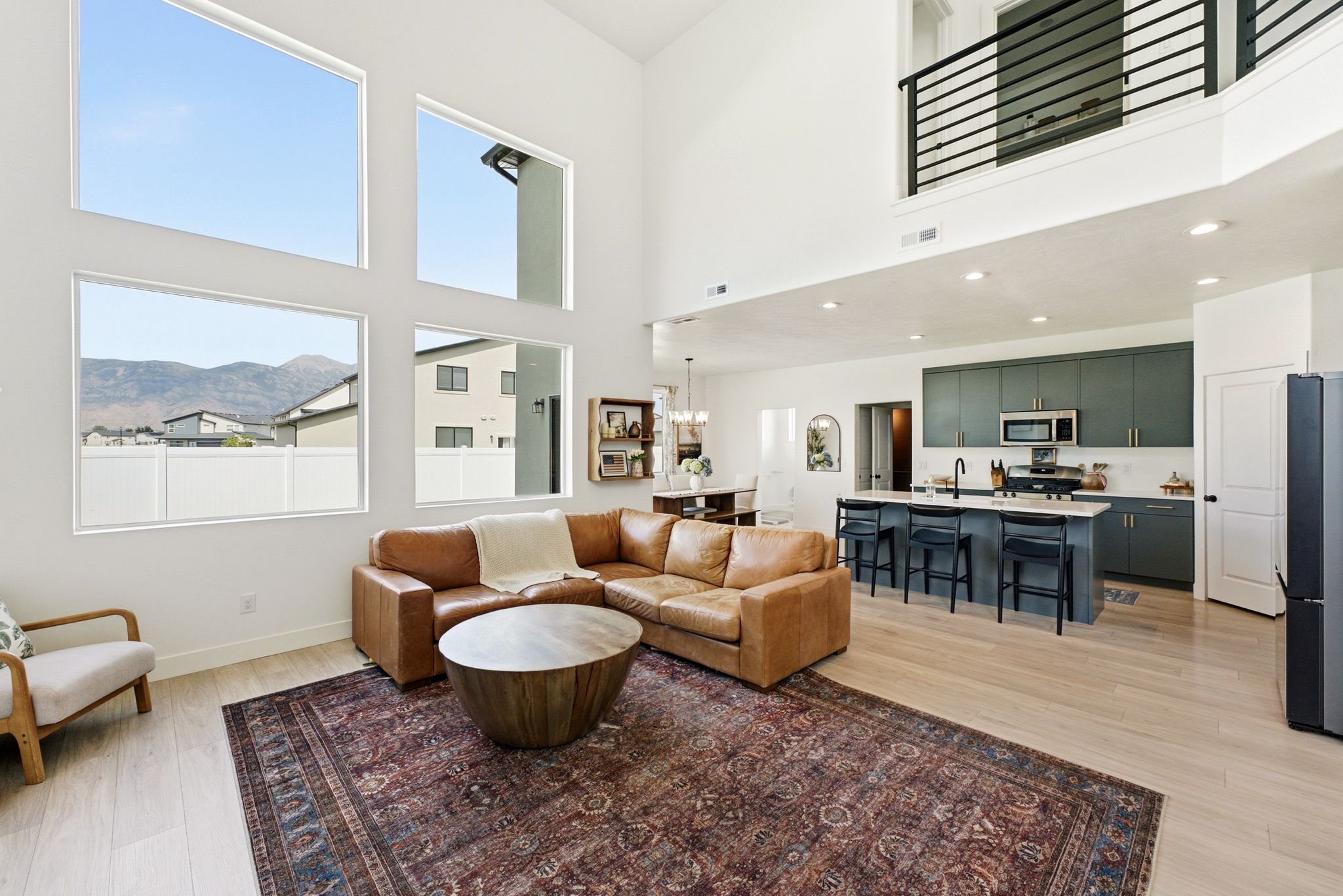 Two-story living area with high ceilings and large windows