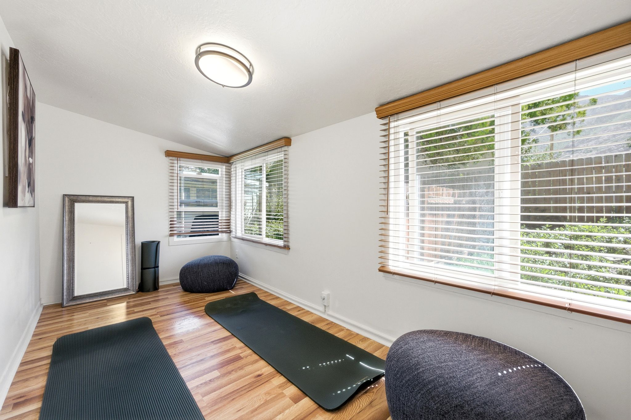 Bright room featuring wood-finish flooring and white walls