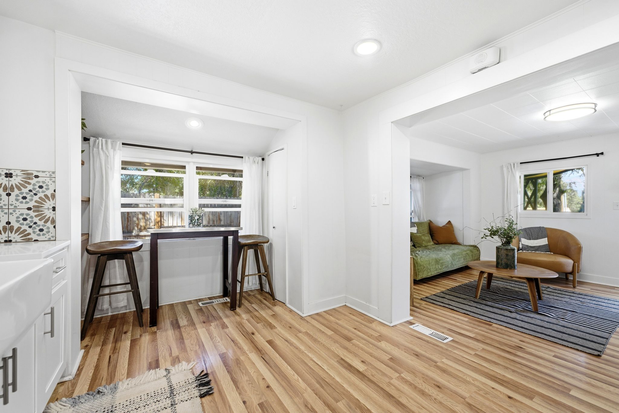 Bright interior with wood-finish flooring throughout