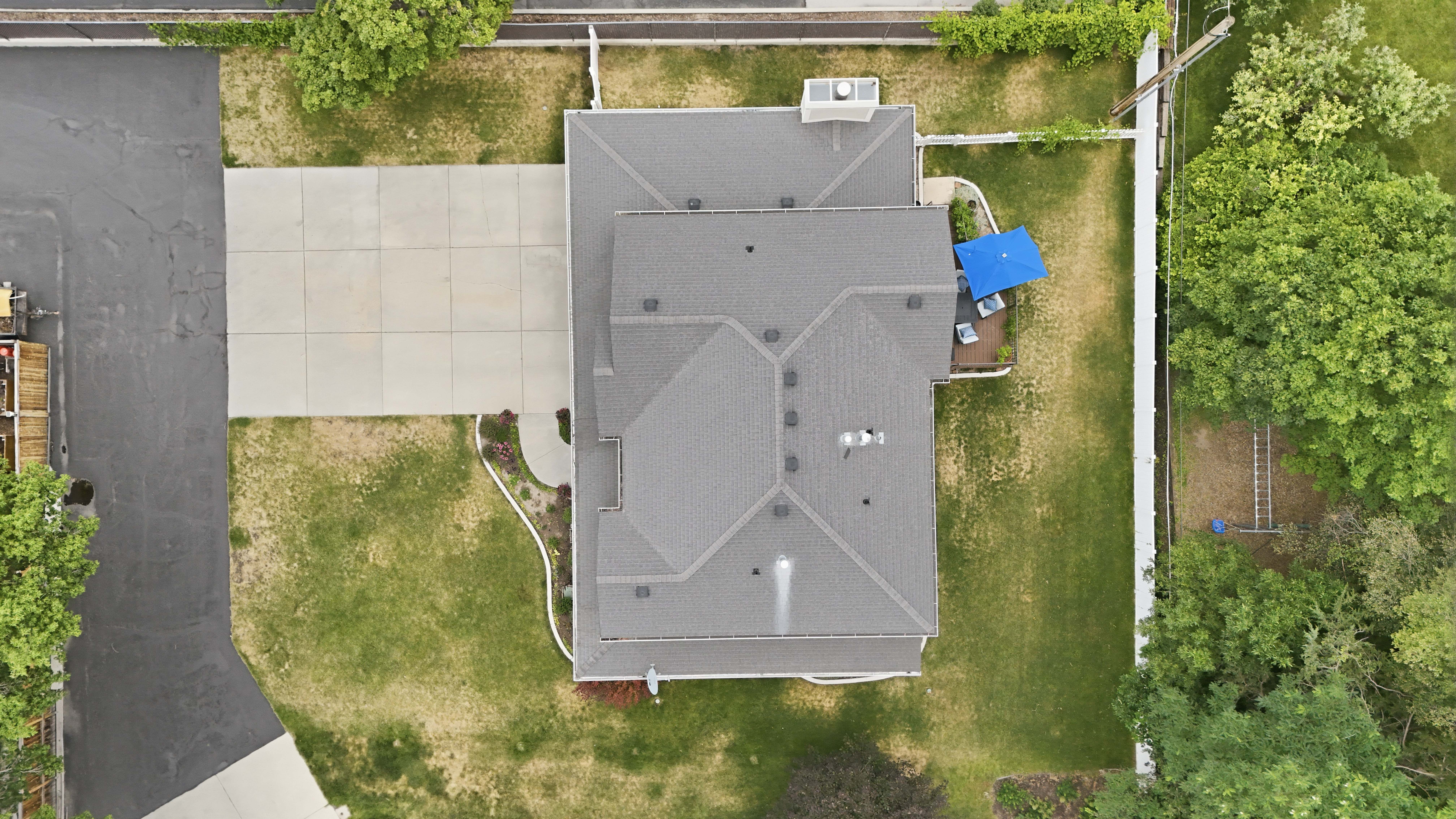 Gray shingle roof structure with multiple gables