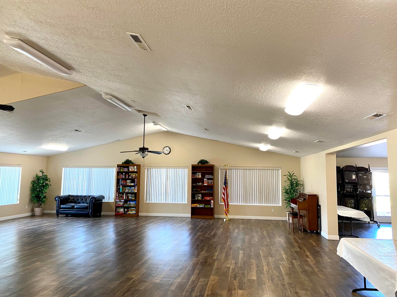 Spacious interior featuring vaulted ceilings and wood-finish flooring