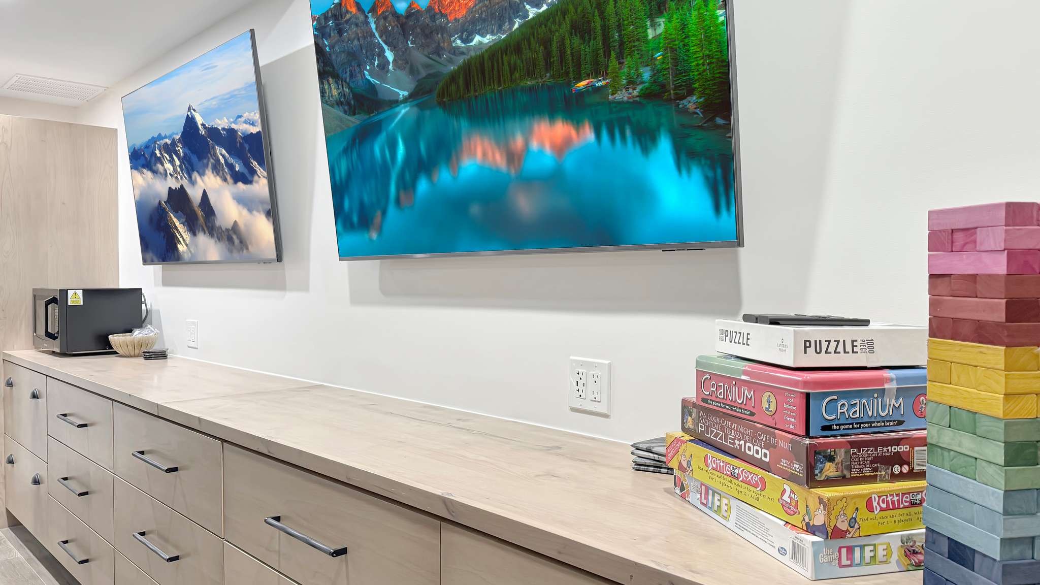 Built-in cabinetry with light wood-finish doors and drawers, featuring modern pull hardware