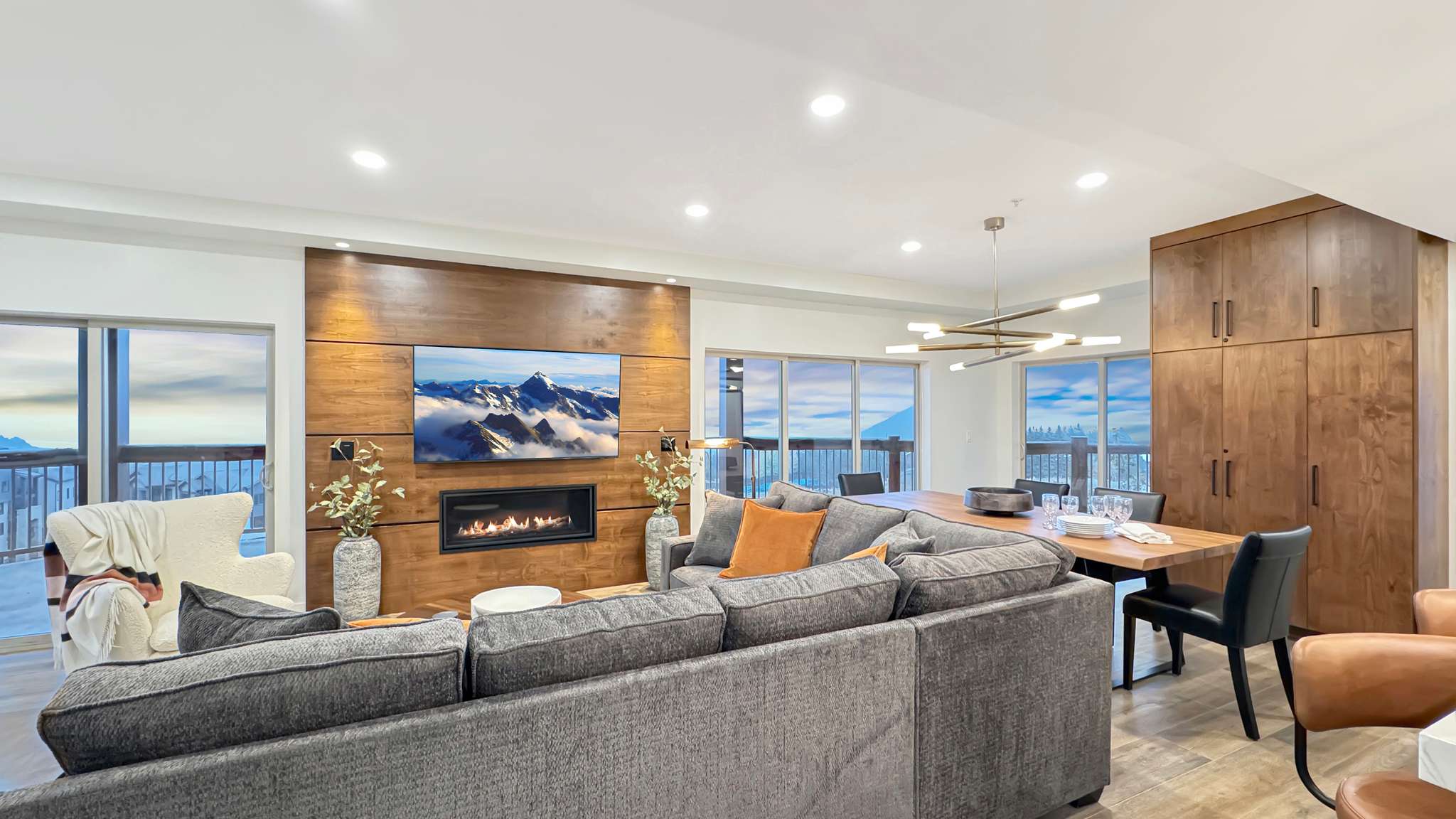 Open concept living area featuring wood-finish flooring and recessed lighting