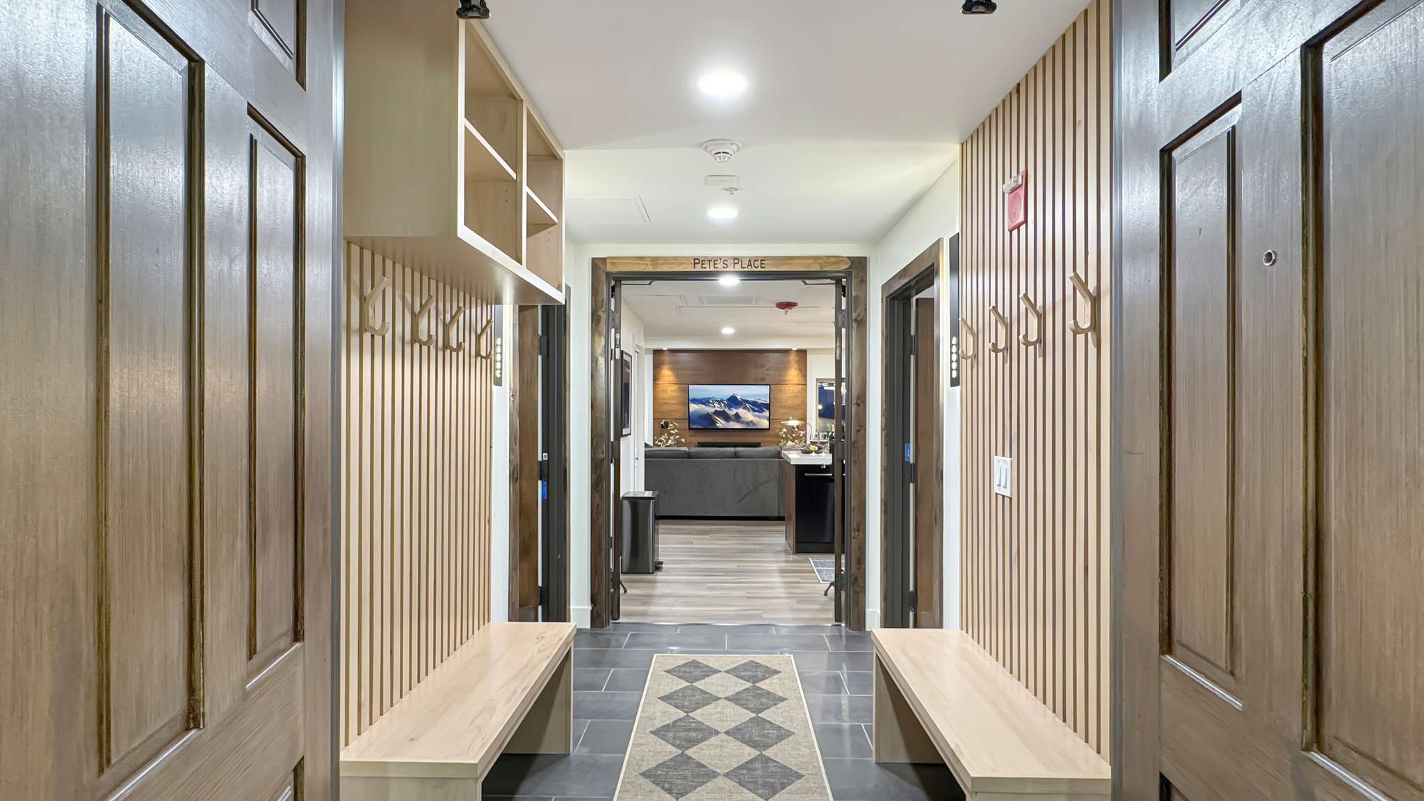 Entryway featuring slate tile flooring and a diamond-patterned runner