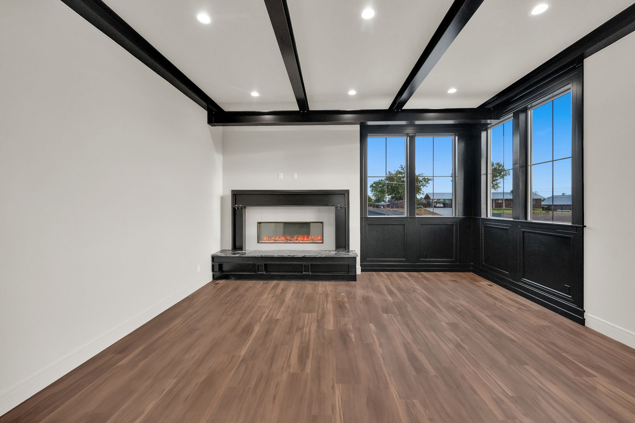 Interior space featuring dark wood-finish flooring and white walls