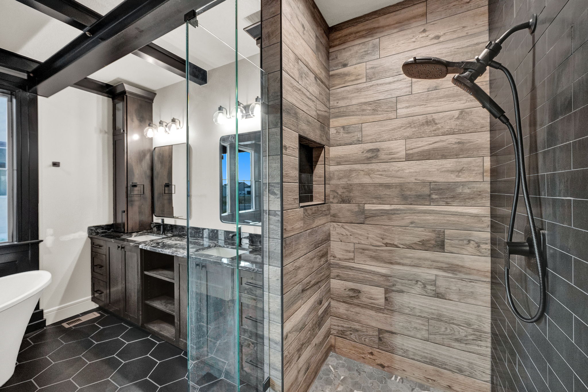 Walk-in shower with wood-finish tile and black subway tile accents