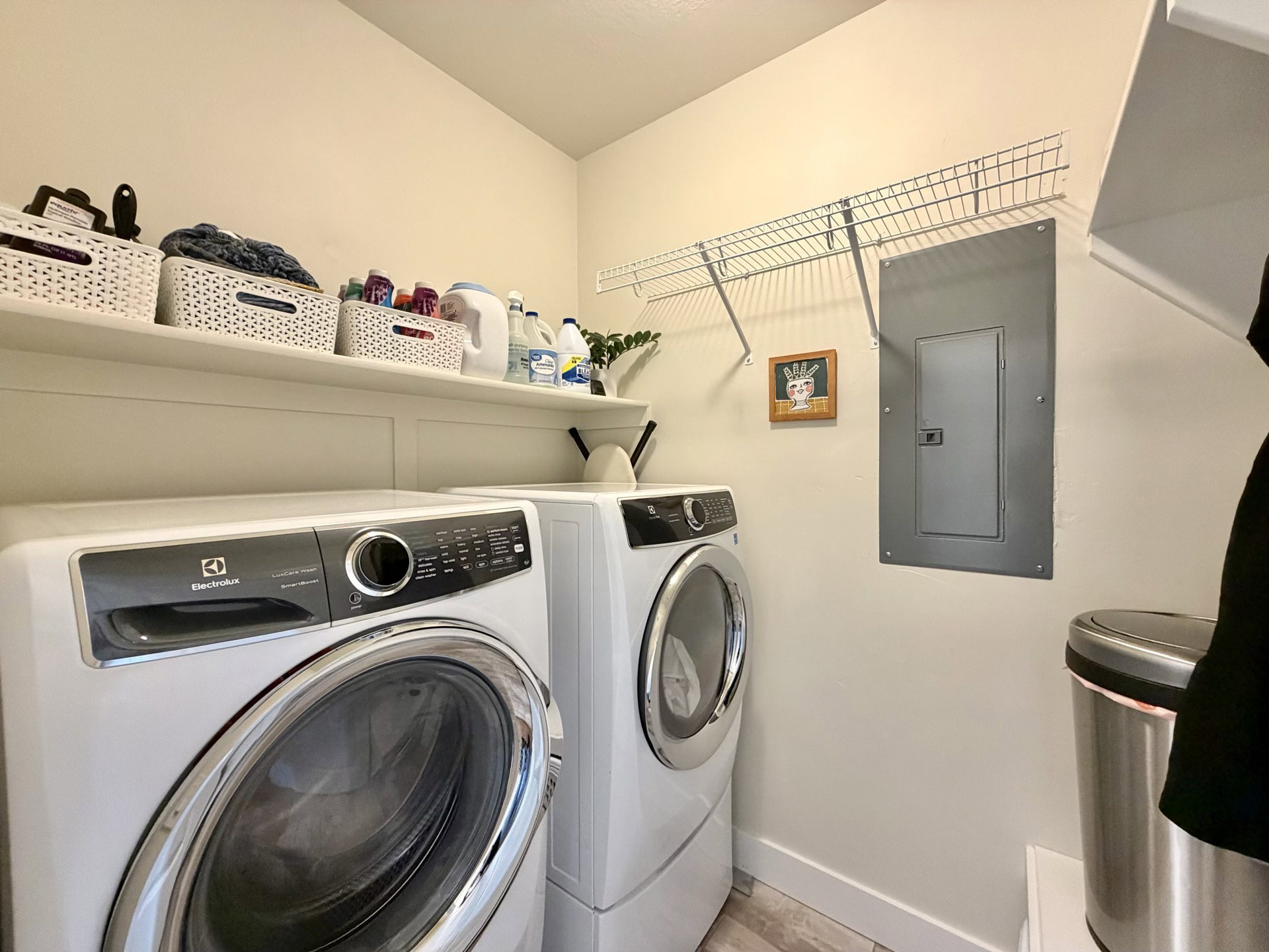 Dedicated laundry area featuring a front-loading washer and dryer set