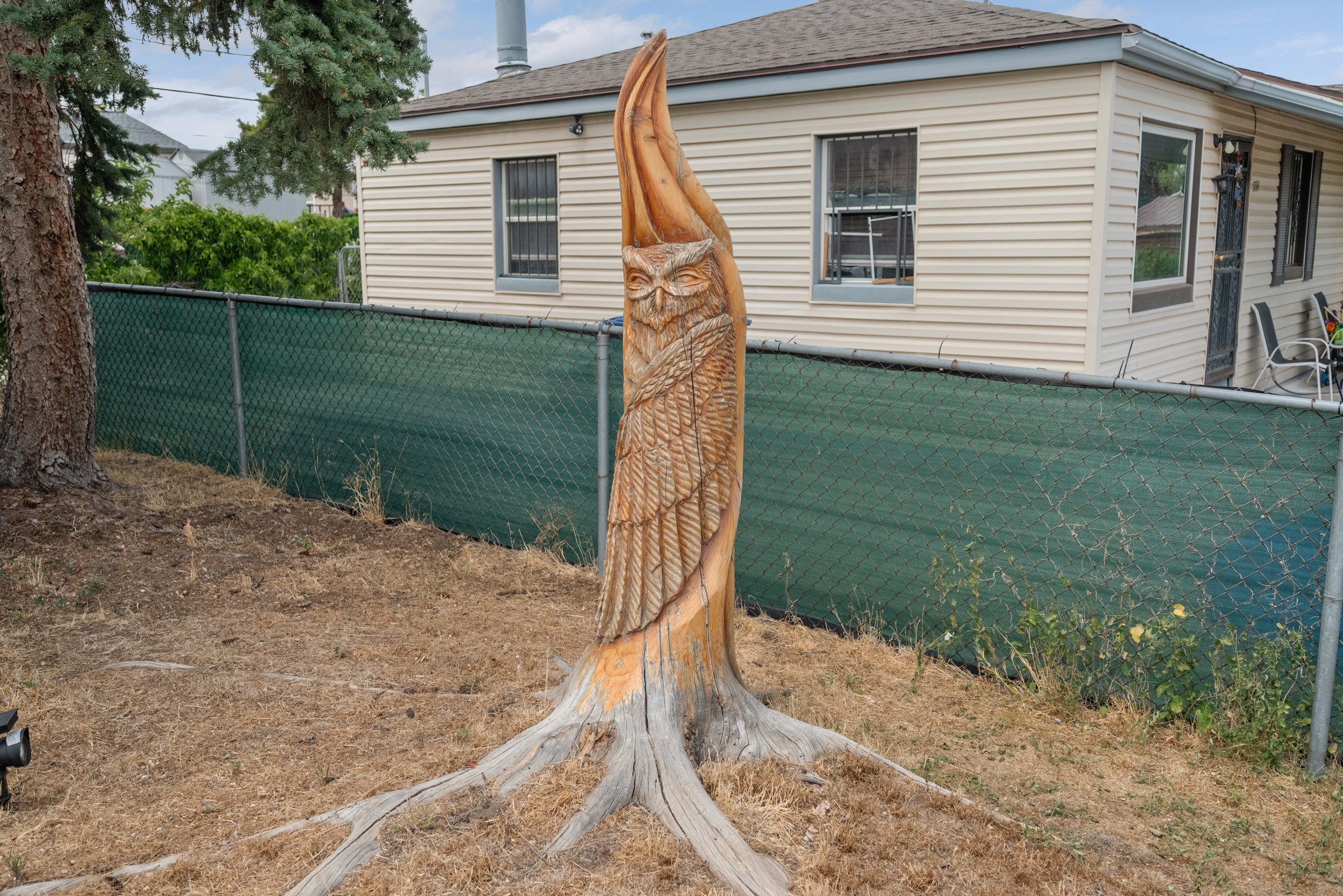 Custom carved wood sculpture featuring an owl motif