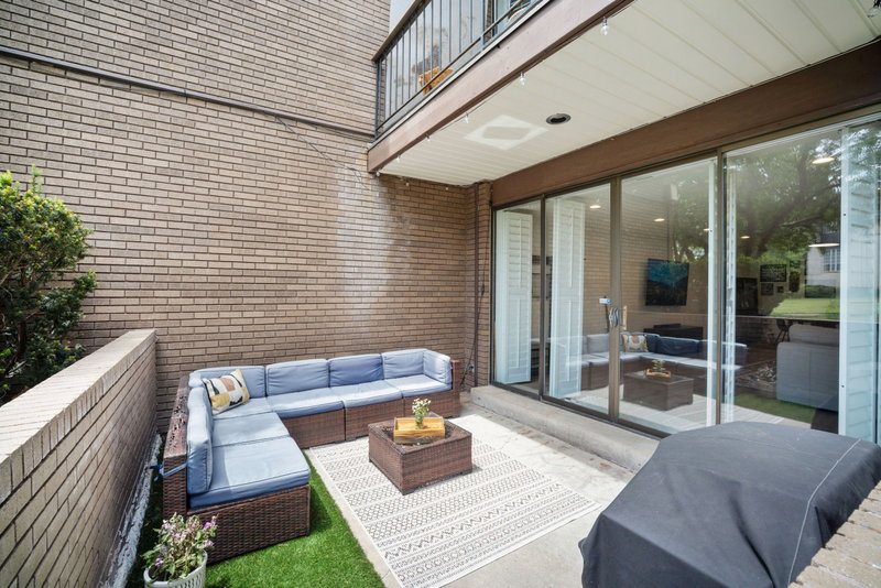 Private patio featuring a concrete surface and artificial turf