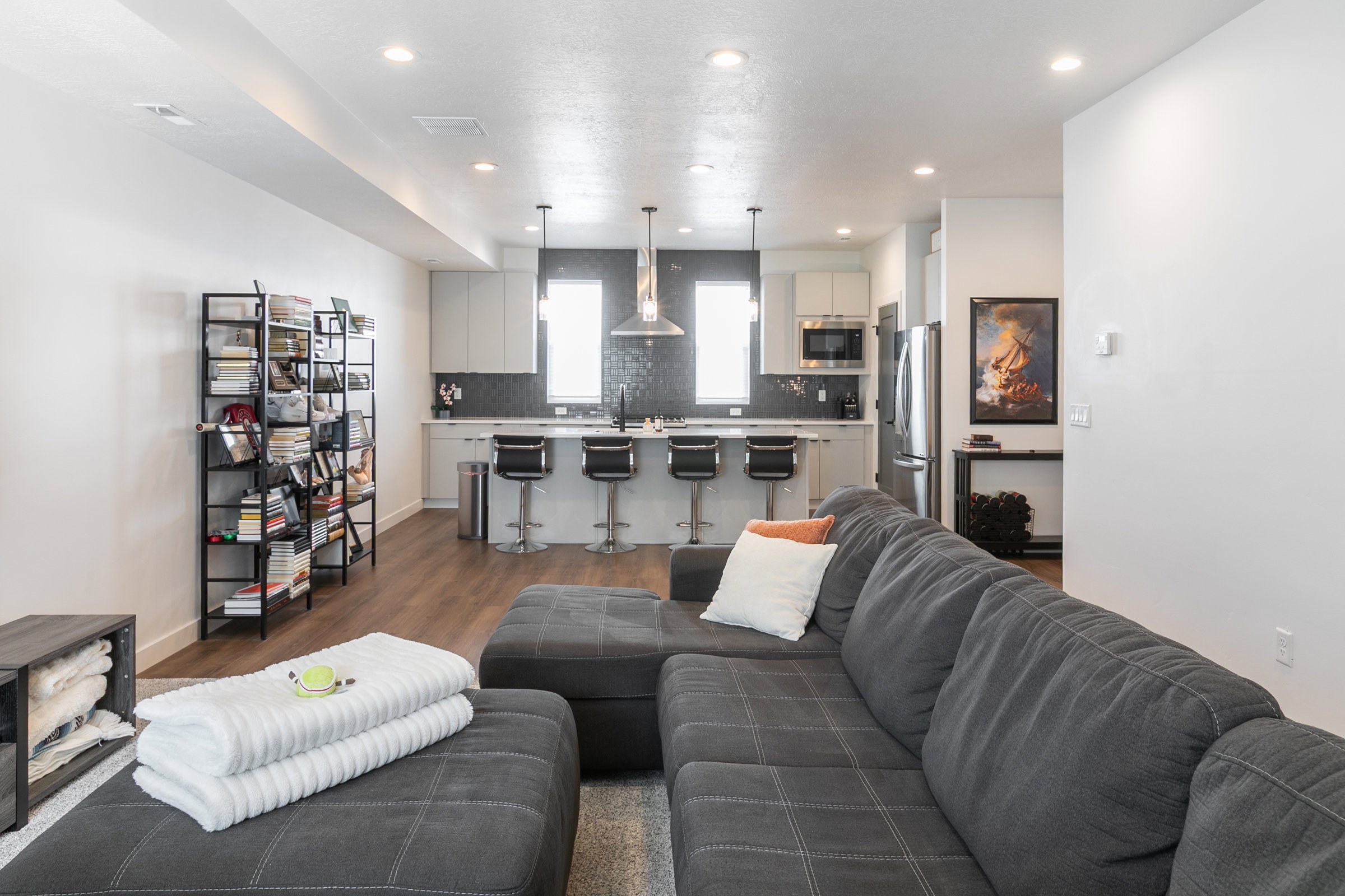 Open-concept living area featuring wood-finish flooring