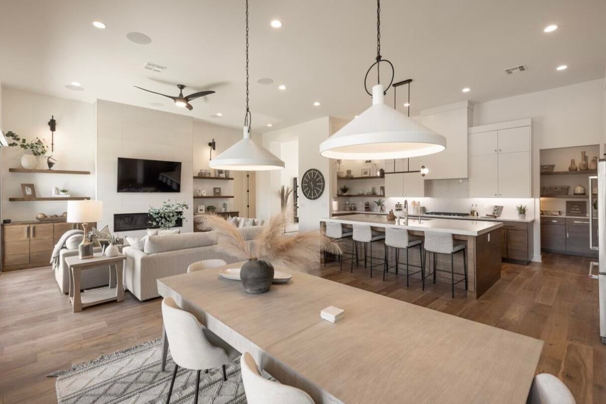Open-concept living space featuring wood-finish flooring throughout