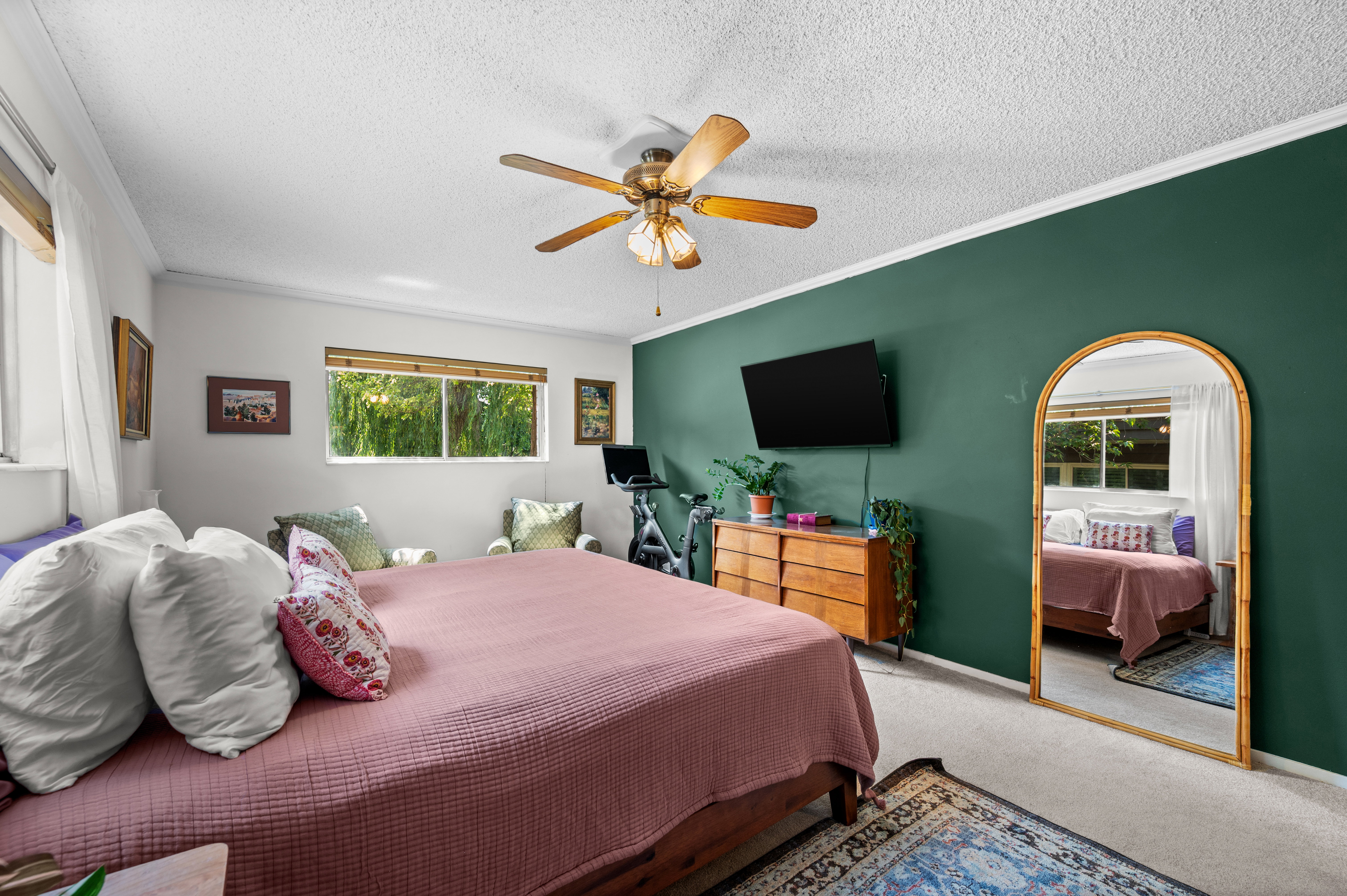 Bedroom with a distinctive green accent wall