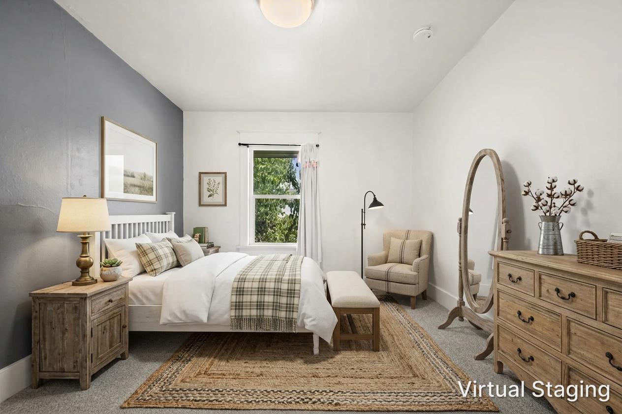Bedroom featuring a window, painted walls, and ceiling-mounted lighting