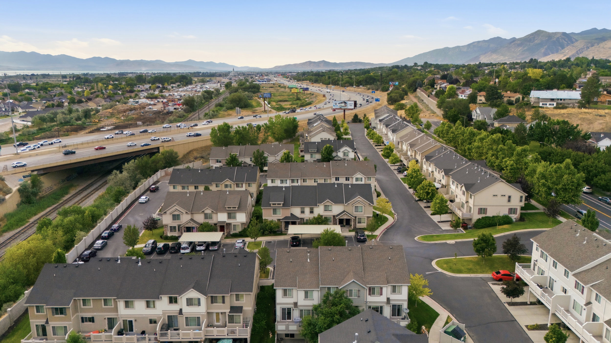 Aerial perspective showcasing a residential community with multi-level townhomes