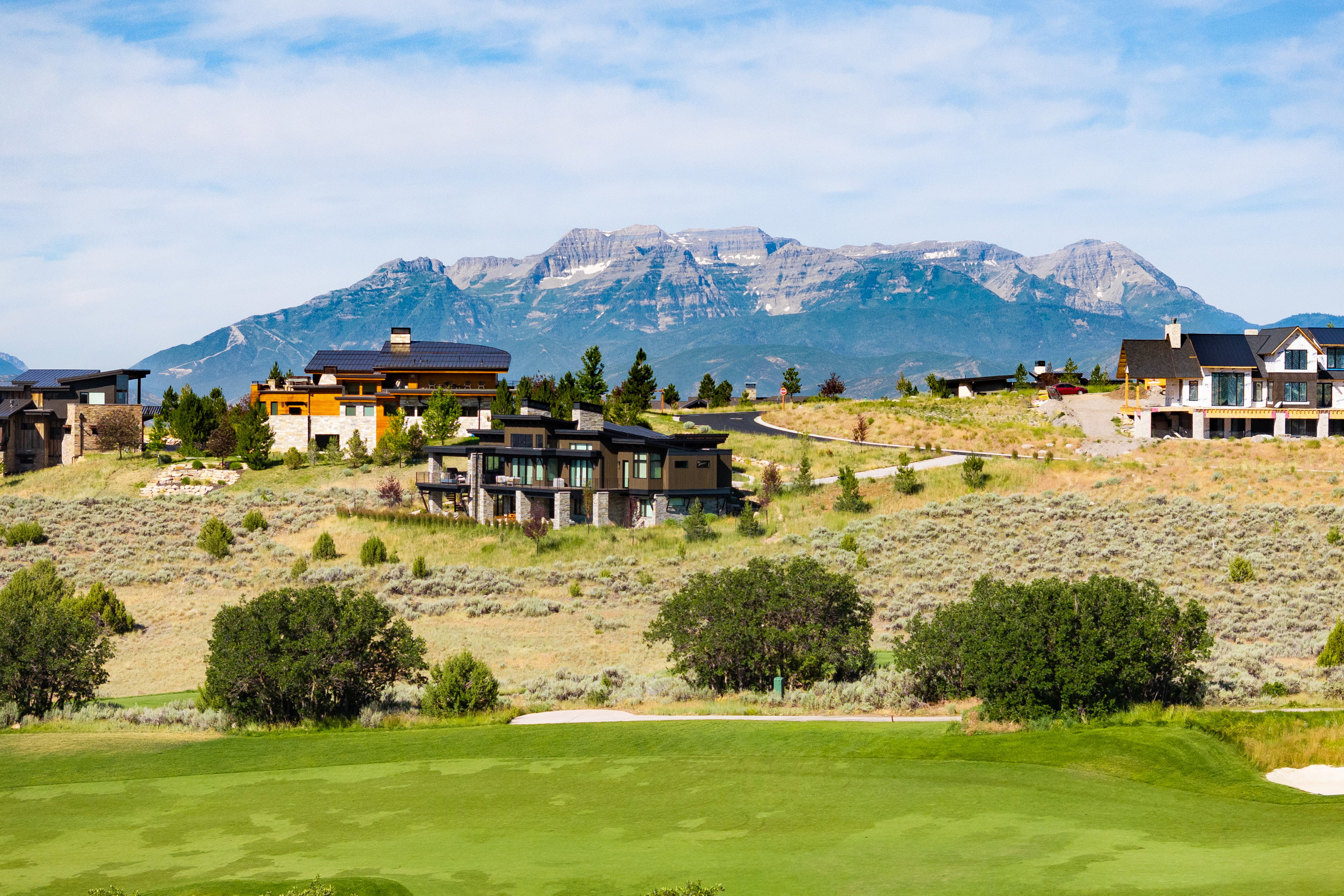 Expansive golf course frontage with a mountain backdrop