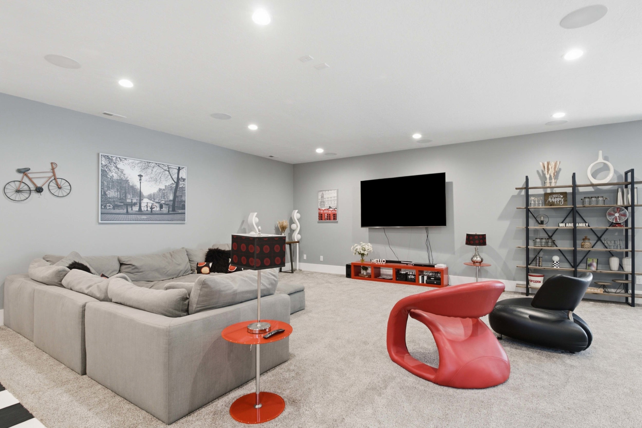 Spacious room featuring light gray walls and plush carpeting
