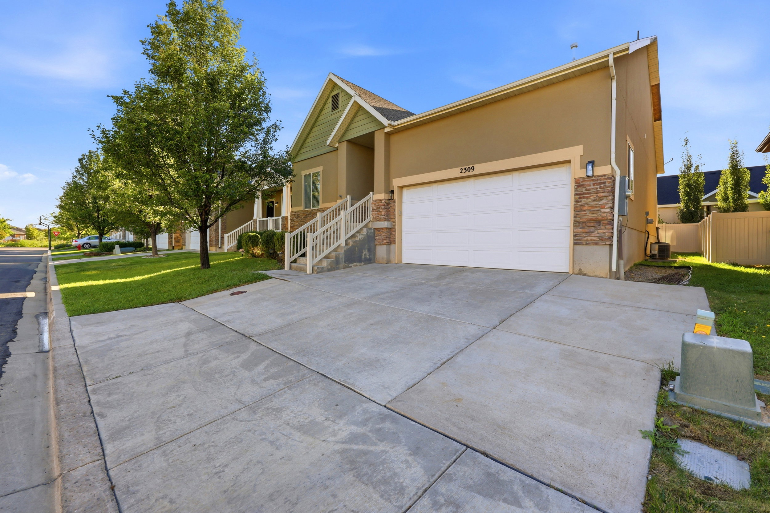 Stucco exterior with stone veneer accents