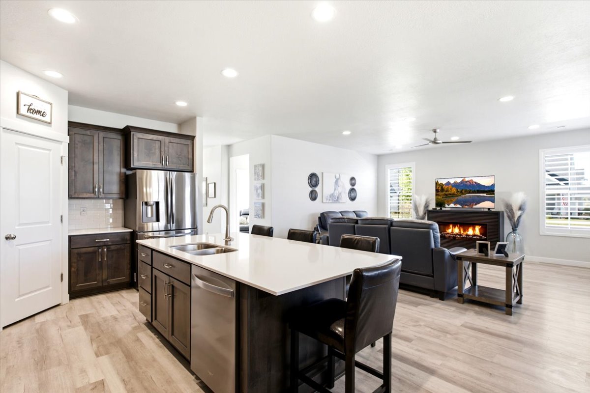 Open-concept living space featuring wood-finish flooring