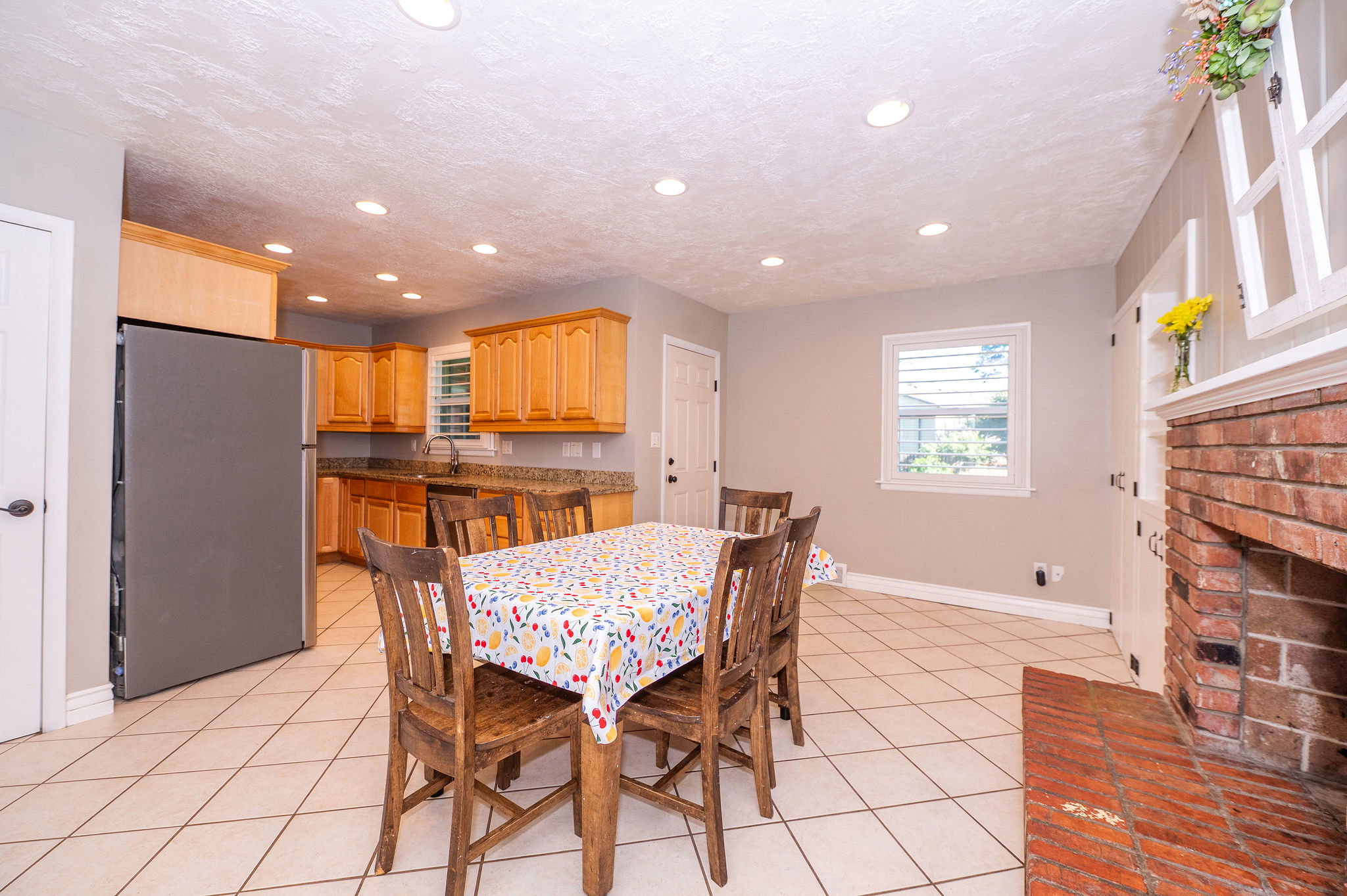 Tile flooring throughout dining area and kitchen