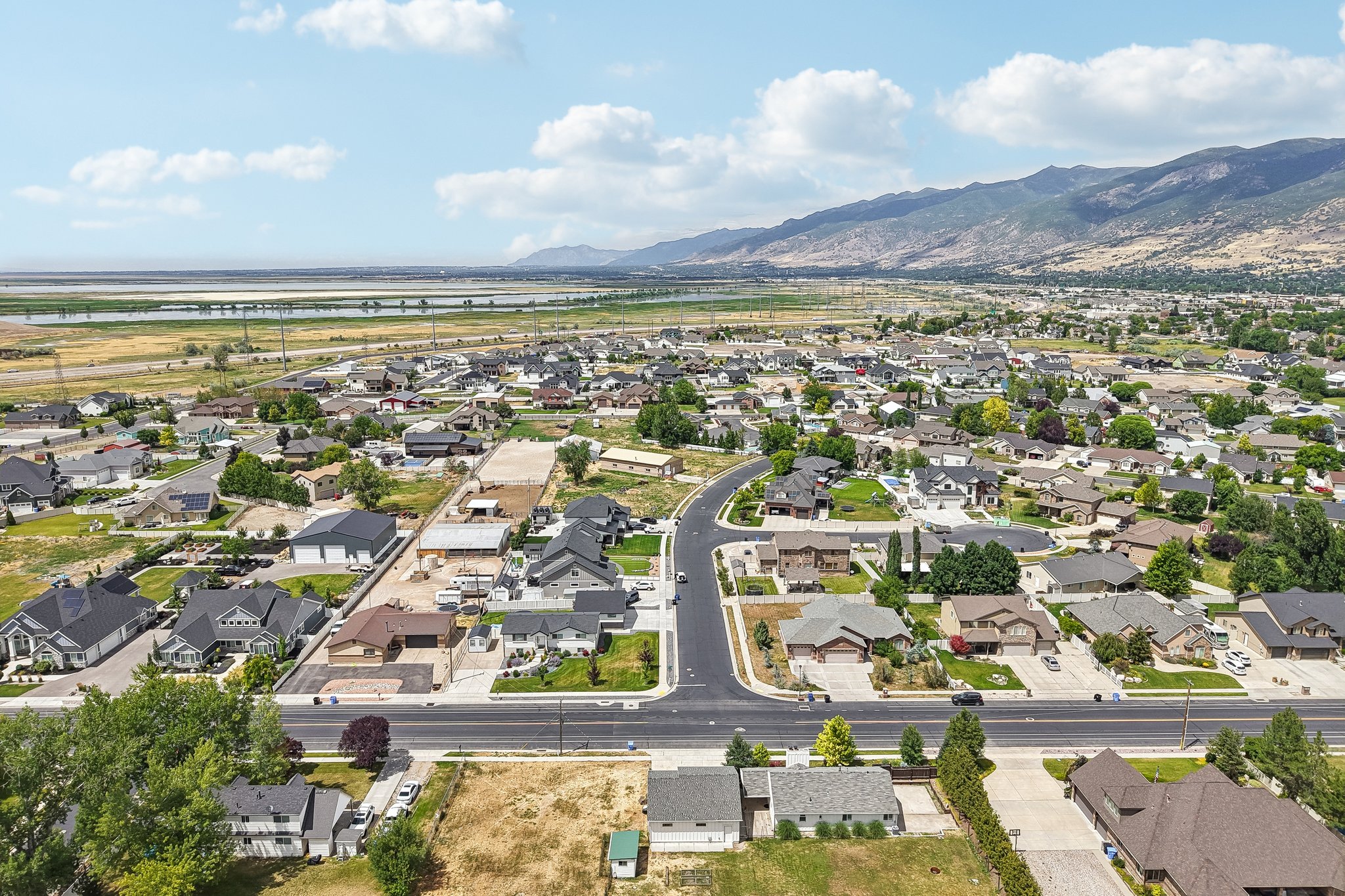 Aerial perspective showcasing a residential community with established homes and new construction