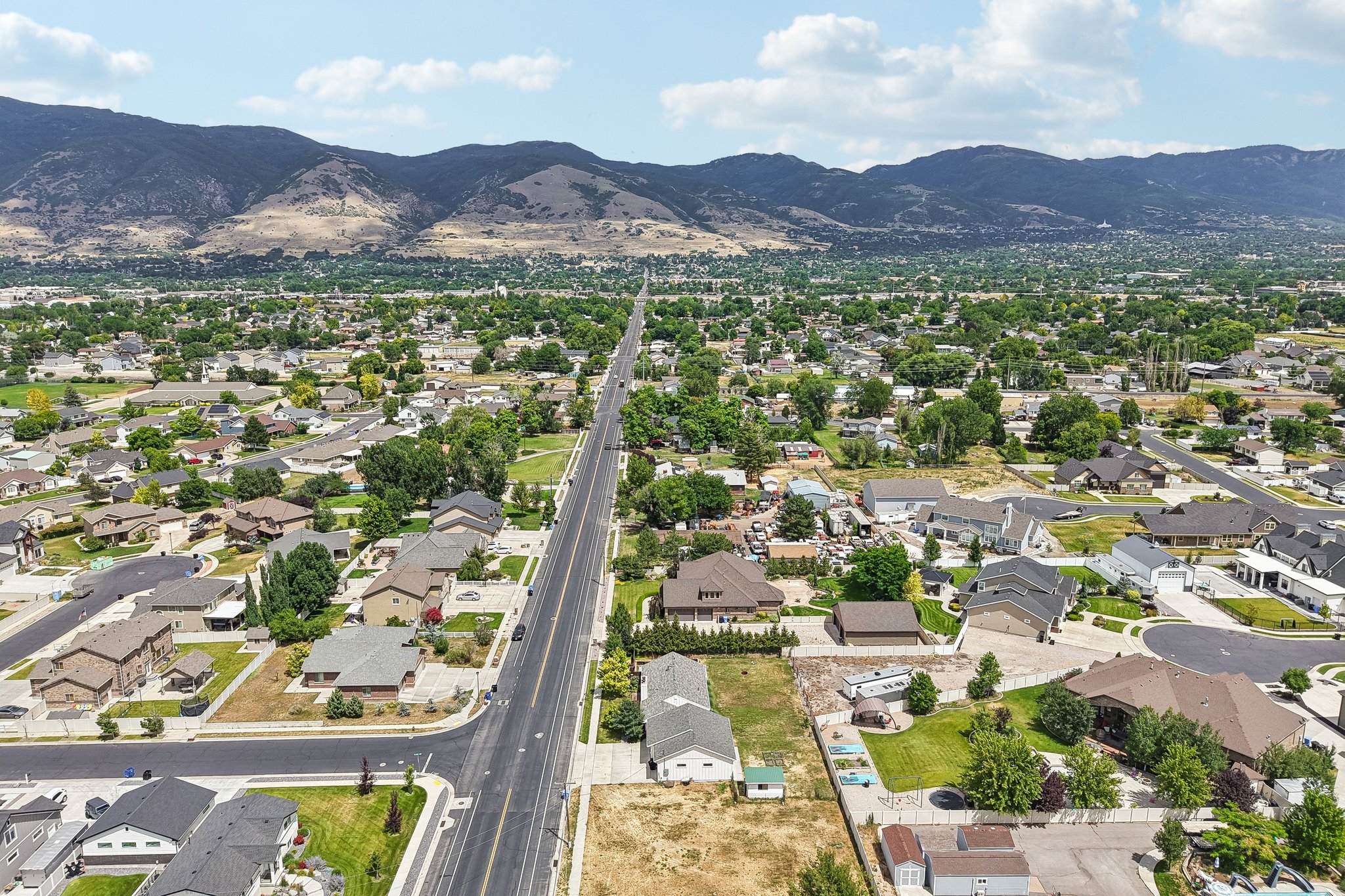 Expansive aerial perspective showcasing a residential neighborhood with diverse housing styles