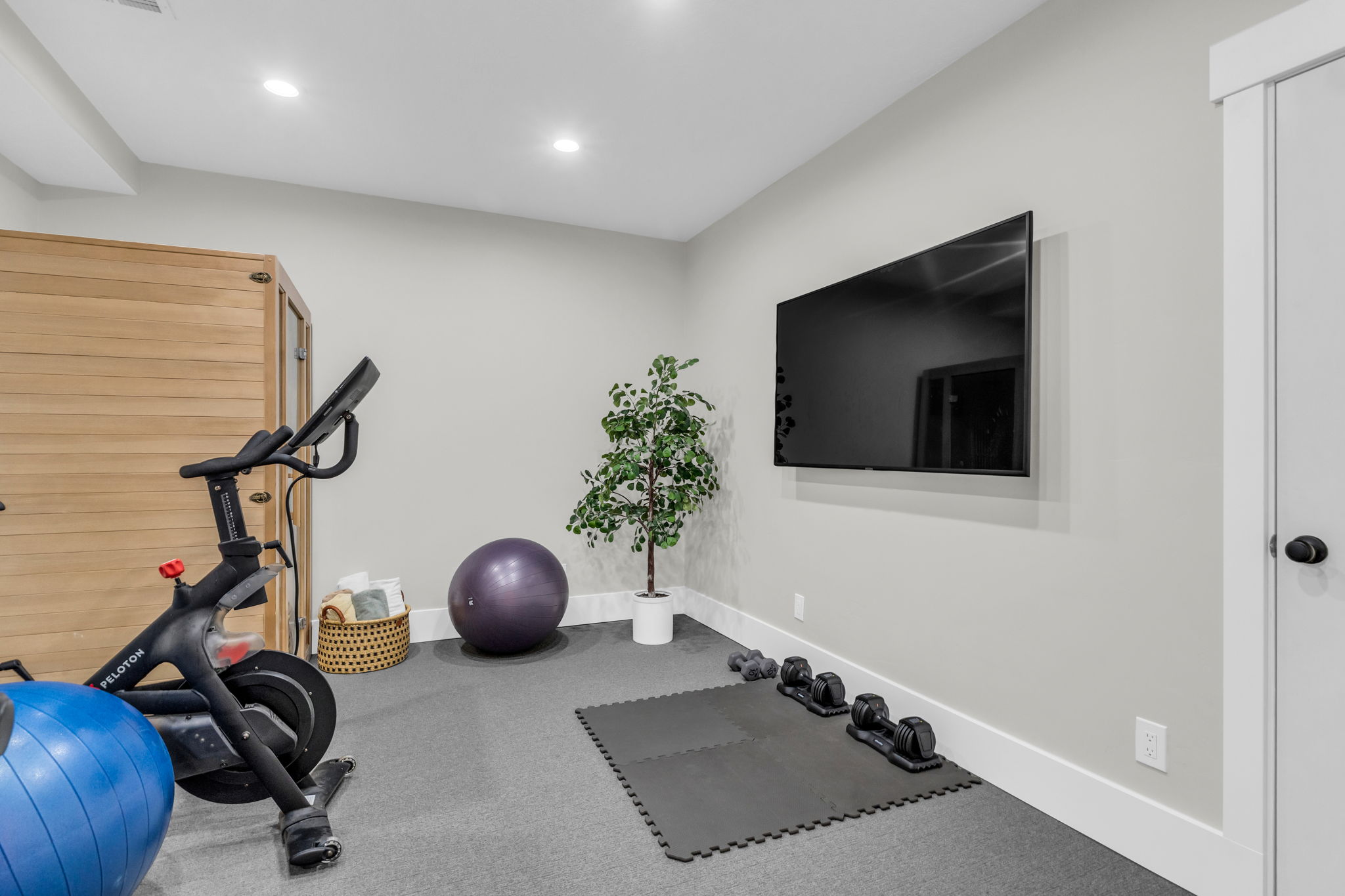 Dedicated fitness space featuring recessed lighting and gray carpeting.  Recently added.