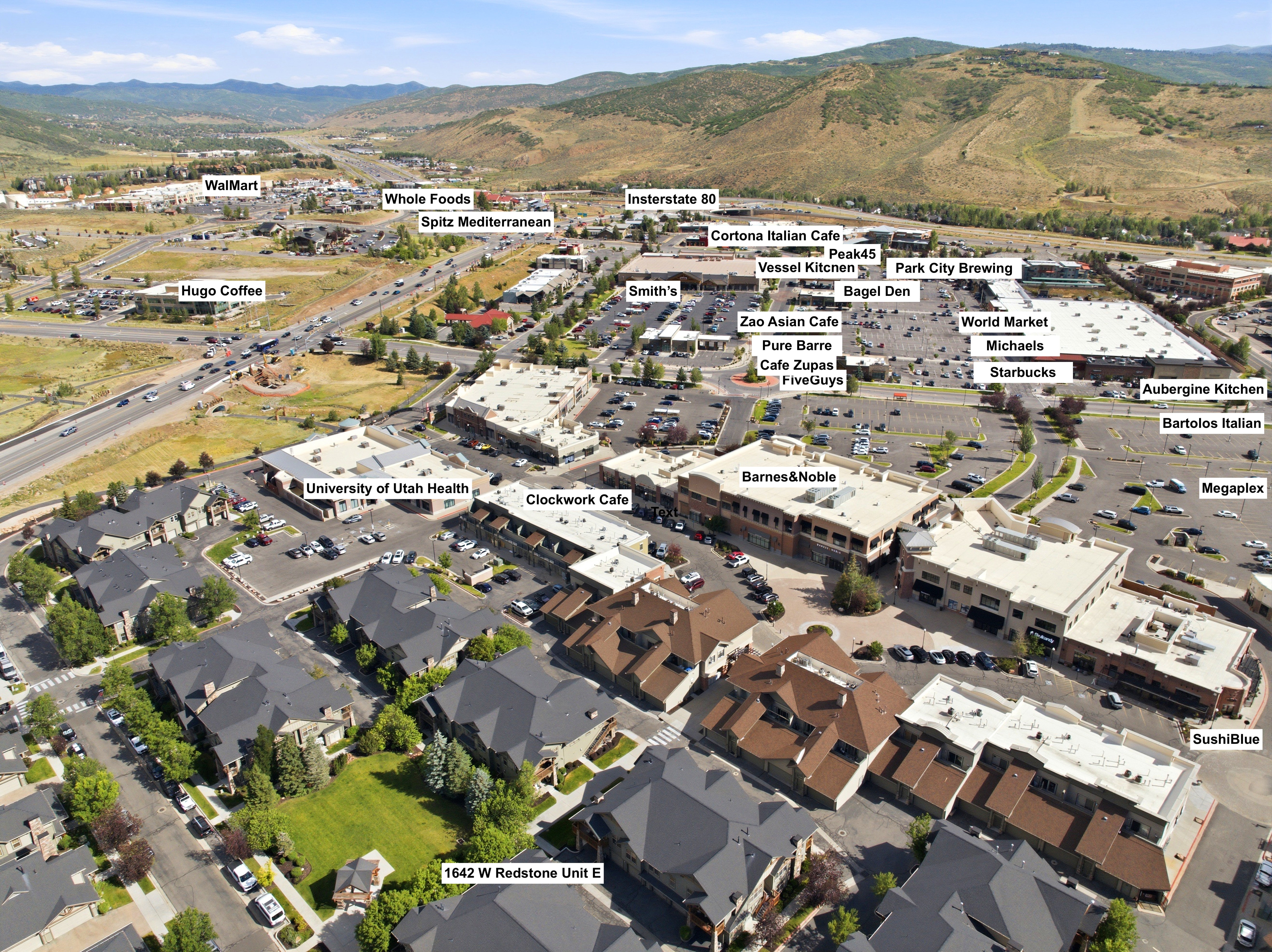 Aerial perspective showcasing a residential development in close proximity to commercial centers