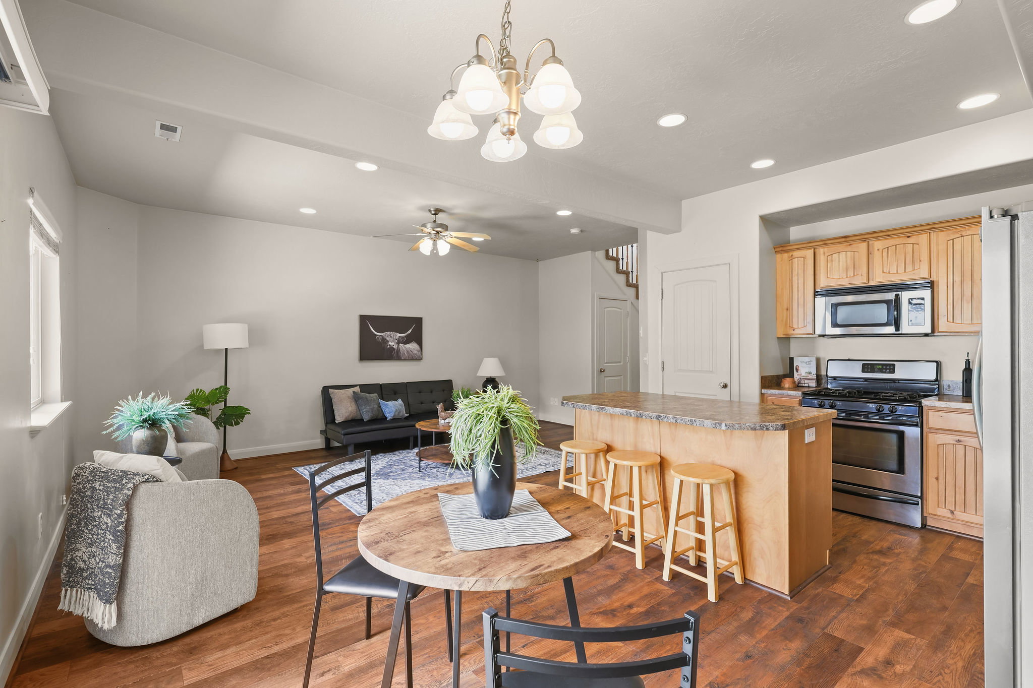 Open-concept living space featuring kitchen bar