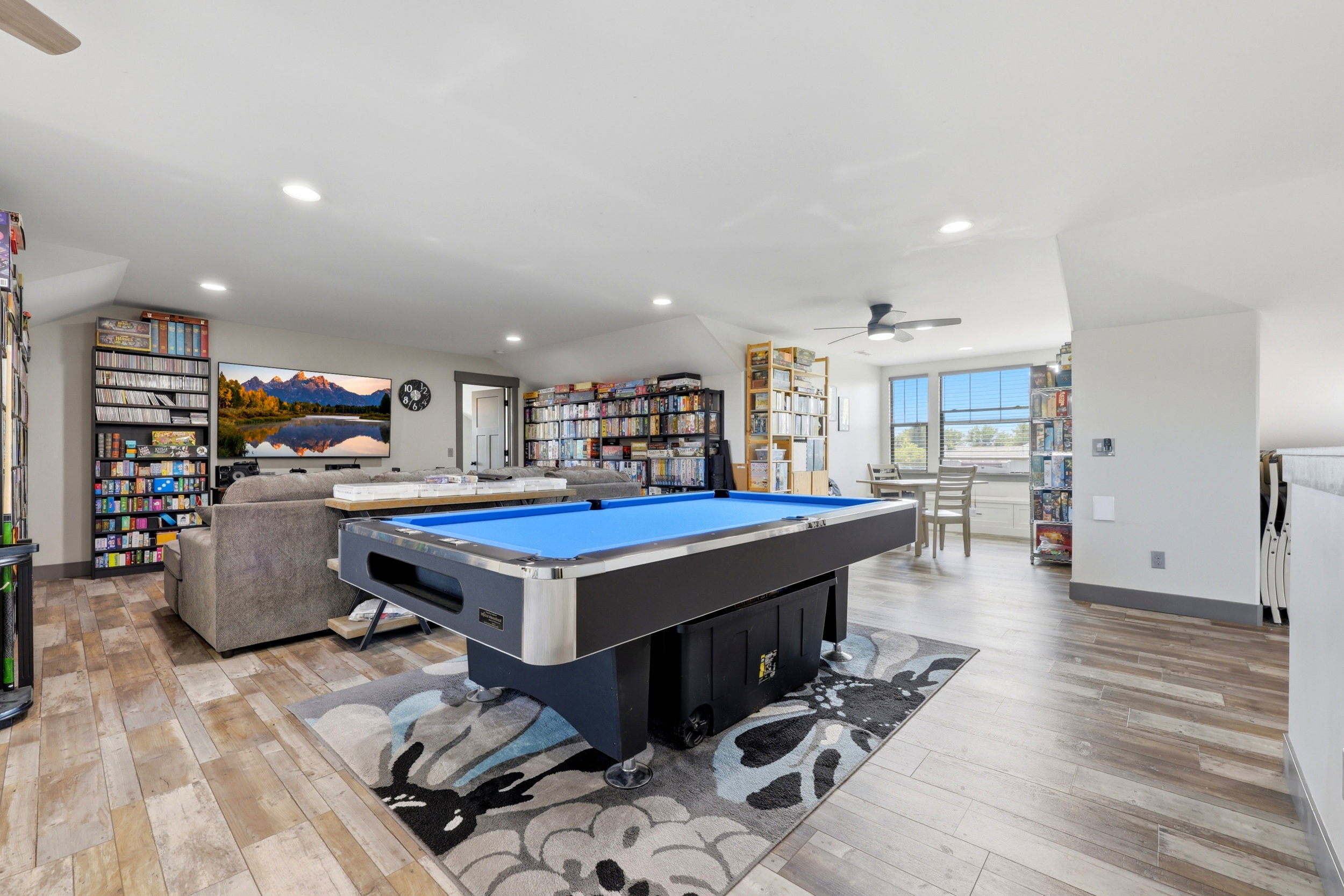 Spacious bonus room featuring wood-finish flooring, recessed lighting, and a ceiling fan