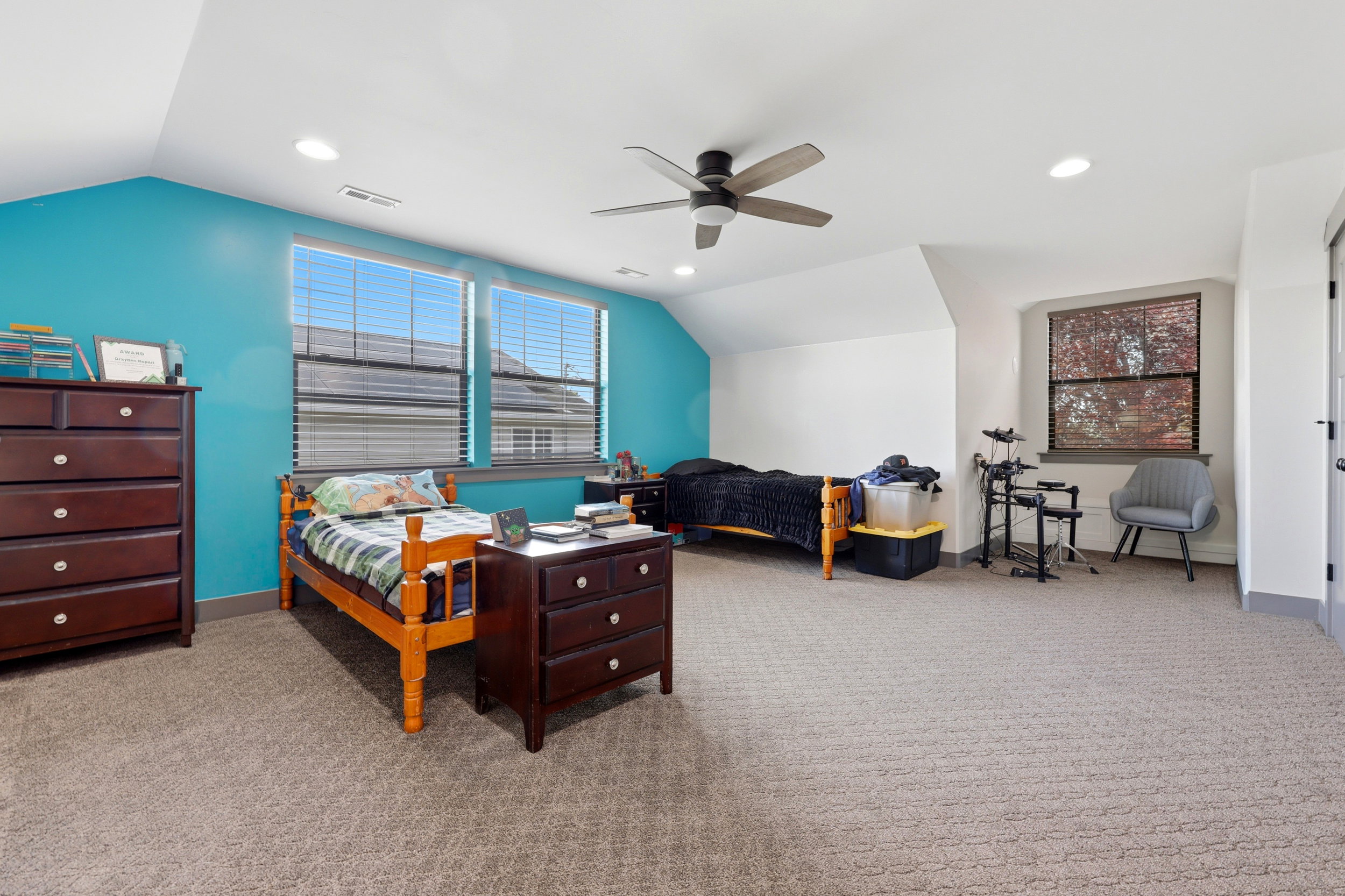 18x15 bedroom with double closets, recessed lighting, and a ceiling fan