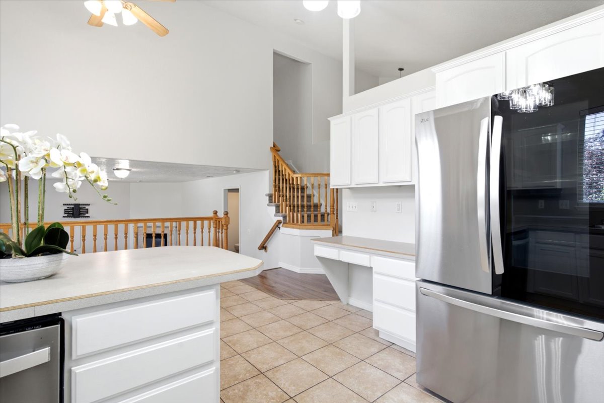 Tile flooring throughout kitchen and dining areas