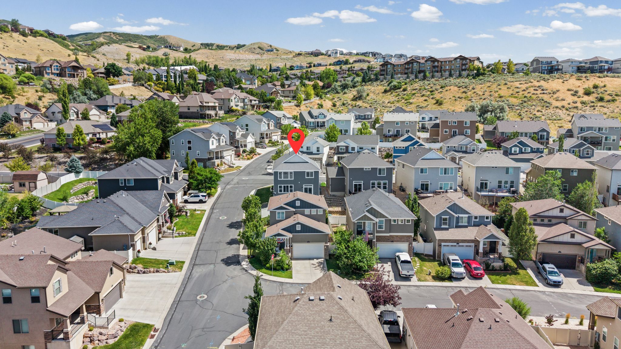 Residential neighborhood featuring a paved street and varied architectural styles
