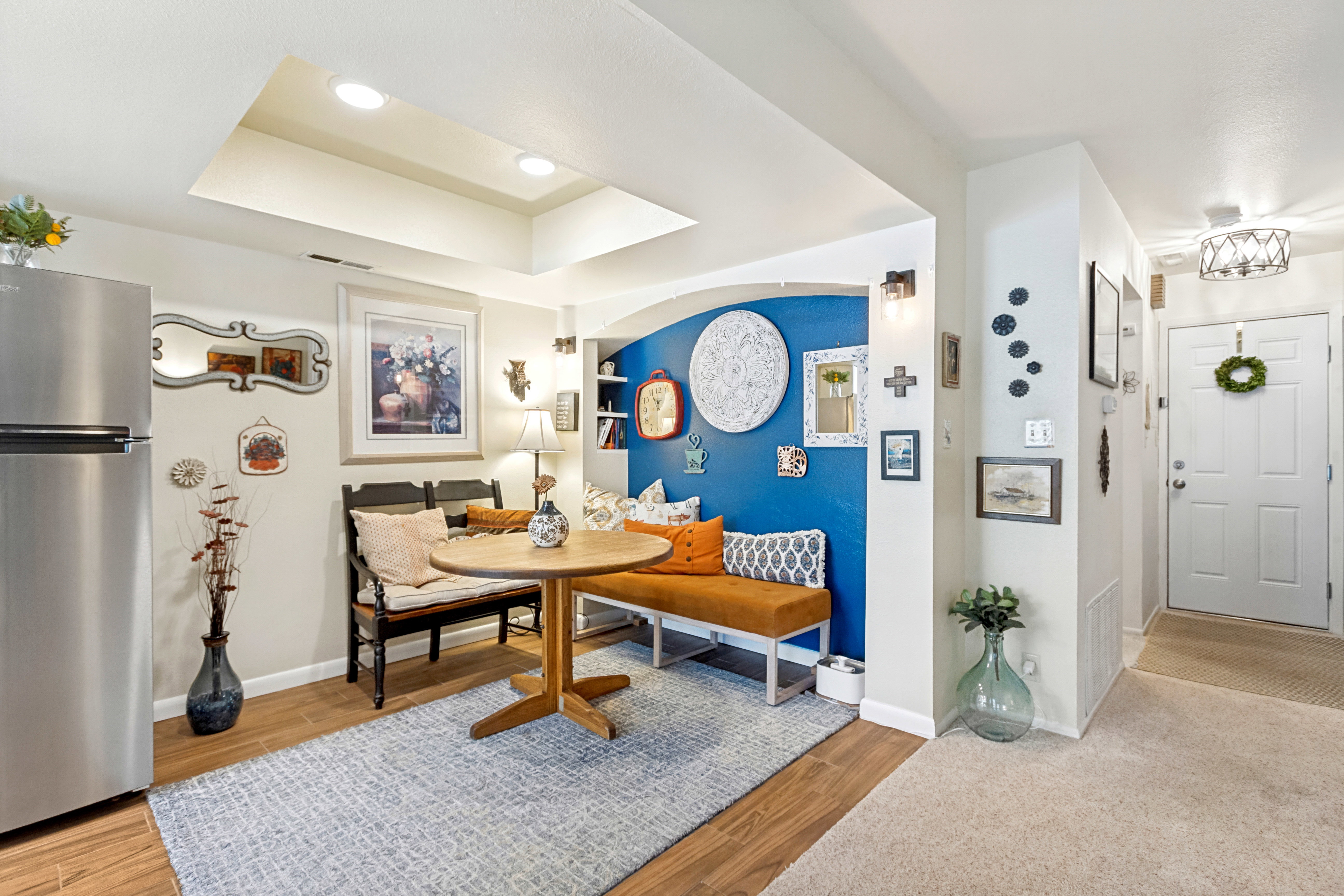 Compact dining area featuring wood-finish flooring and recessed lighting
