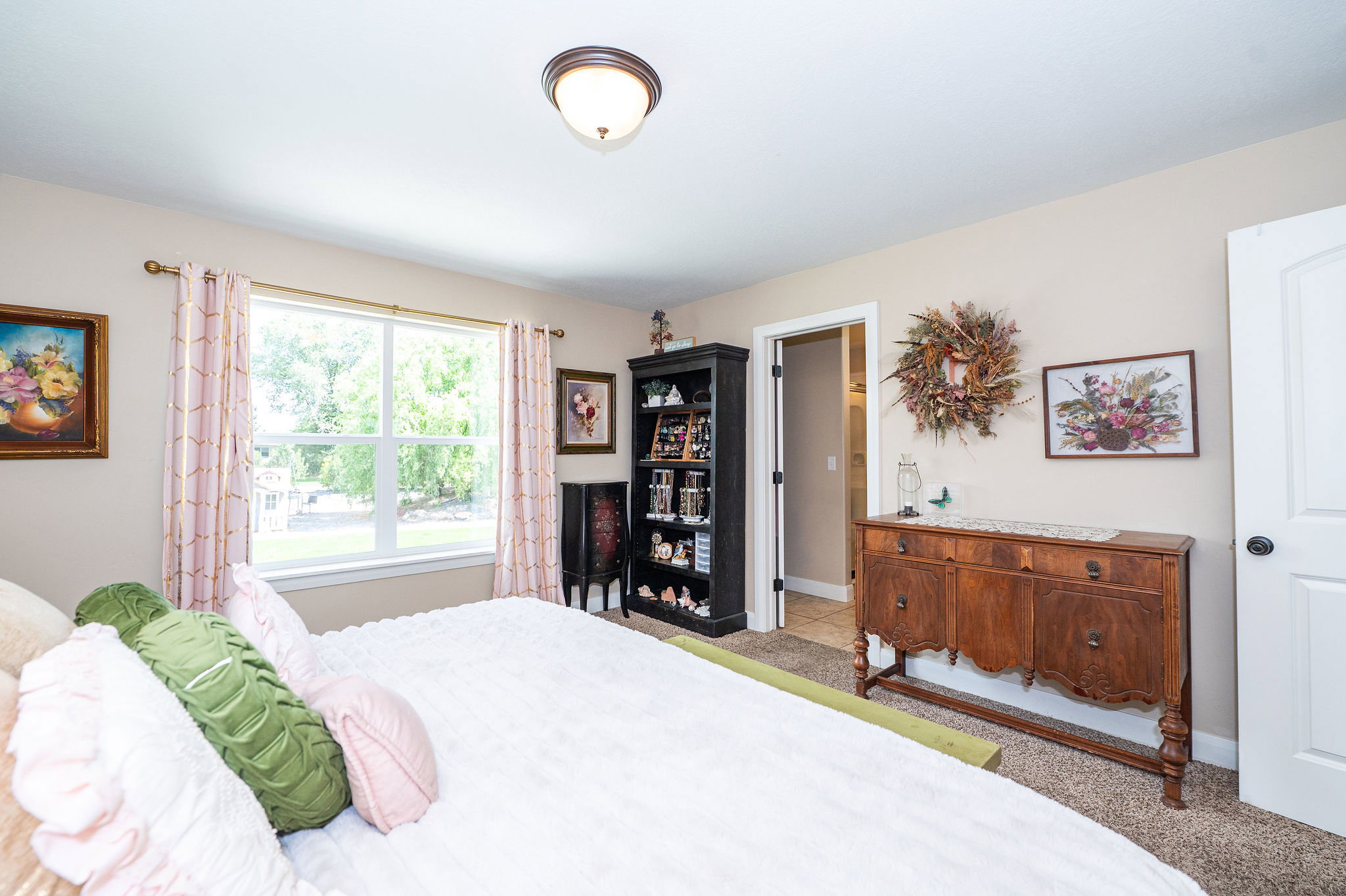 Bedroom featuring a dual-pane window, neutral wall paint, and a semi-flush mount ceiling light