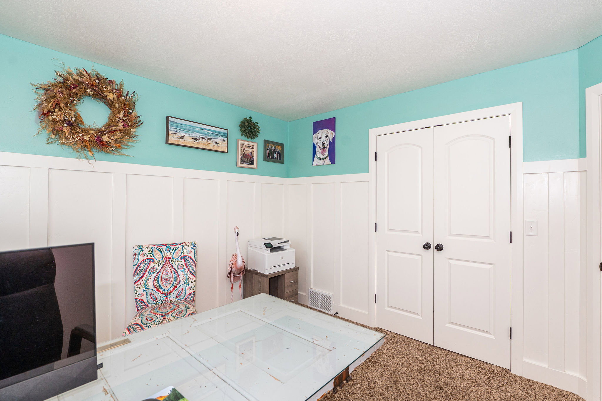 White board and batten paneling with a contrasting aqua wall color