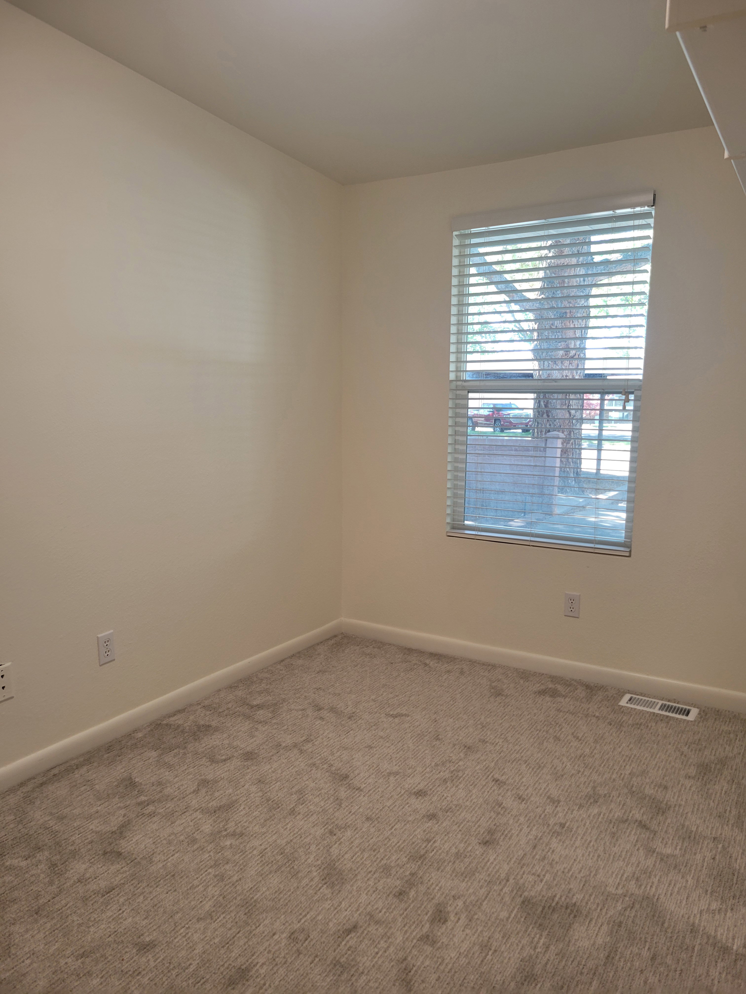 2nd bedroom or office with fresh paint and new carpet.