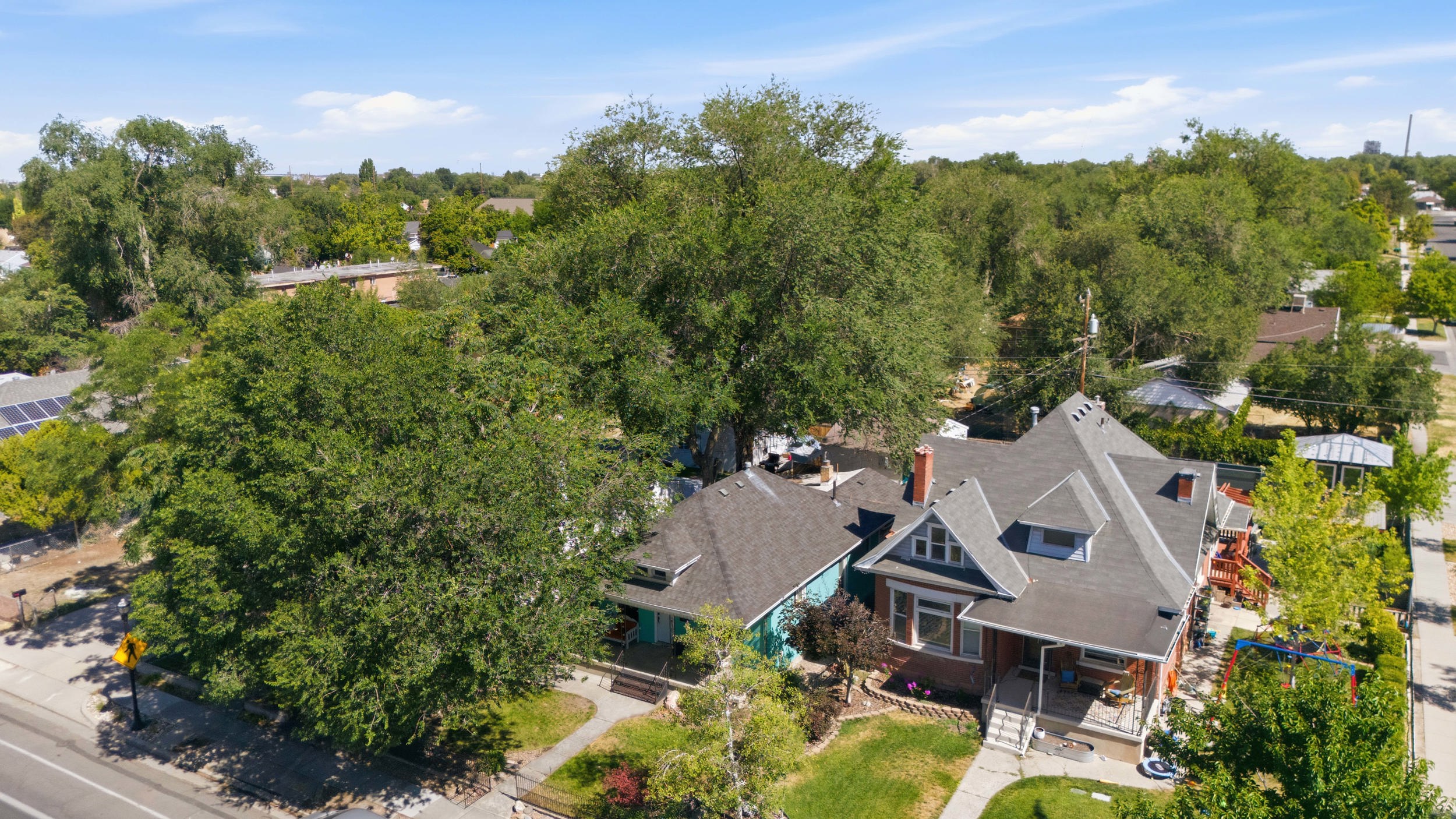 Craftsman-style home featuring a brick exterior and a multi-gabled roofline