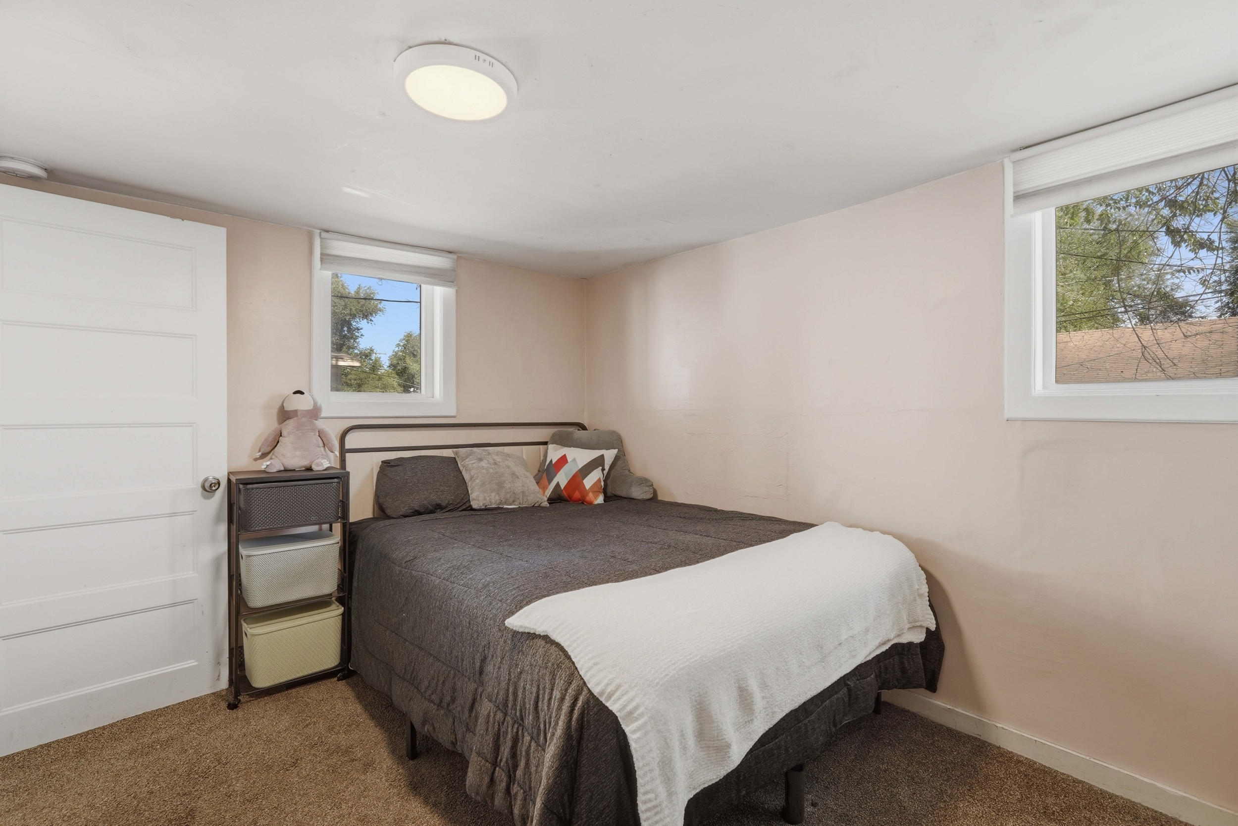 Bedroom #2, Carpeted room with two windows, a white ceiling, and light-colored walls