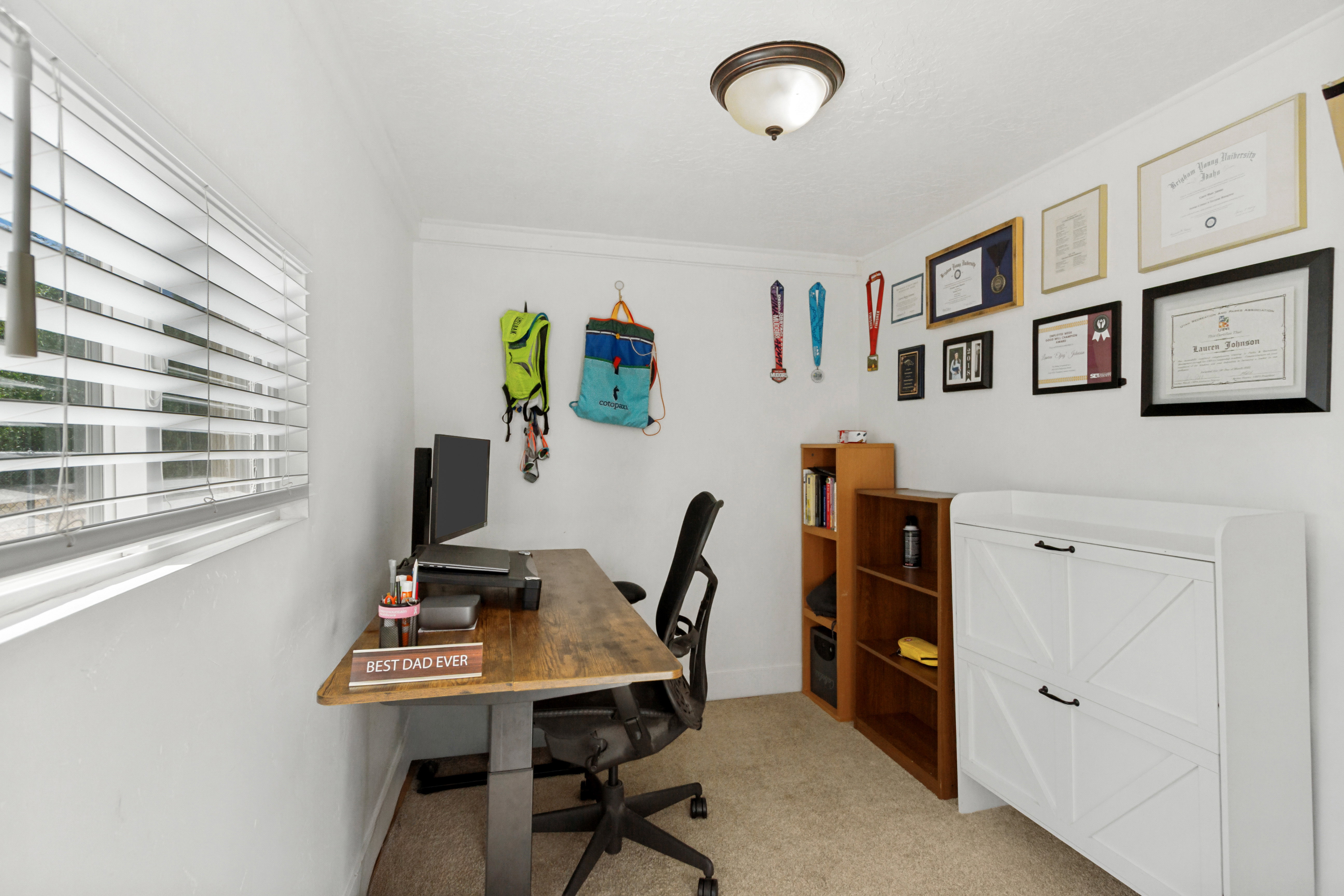 Room with white walls and carpeted flooring