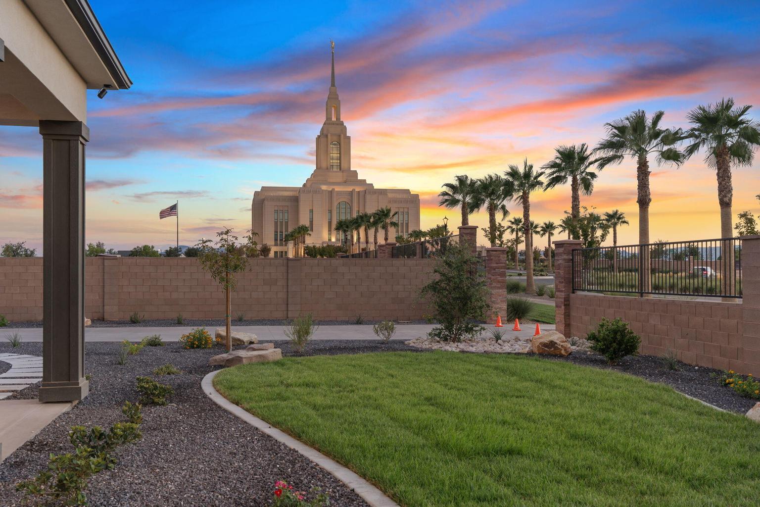 Landscaped front yard with a manicured lawn, gravel accents, and mature plantings