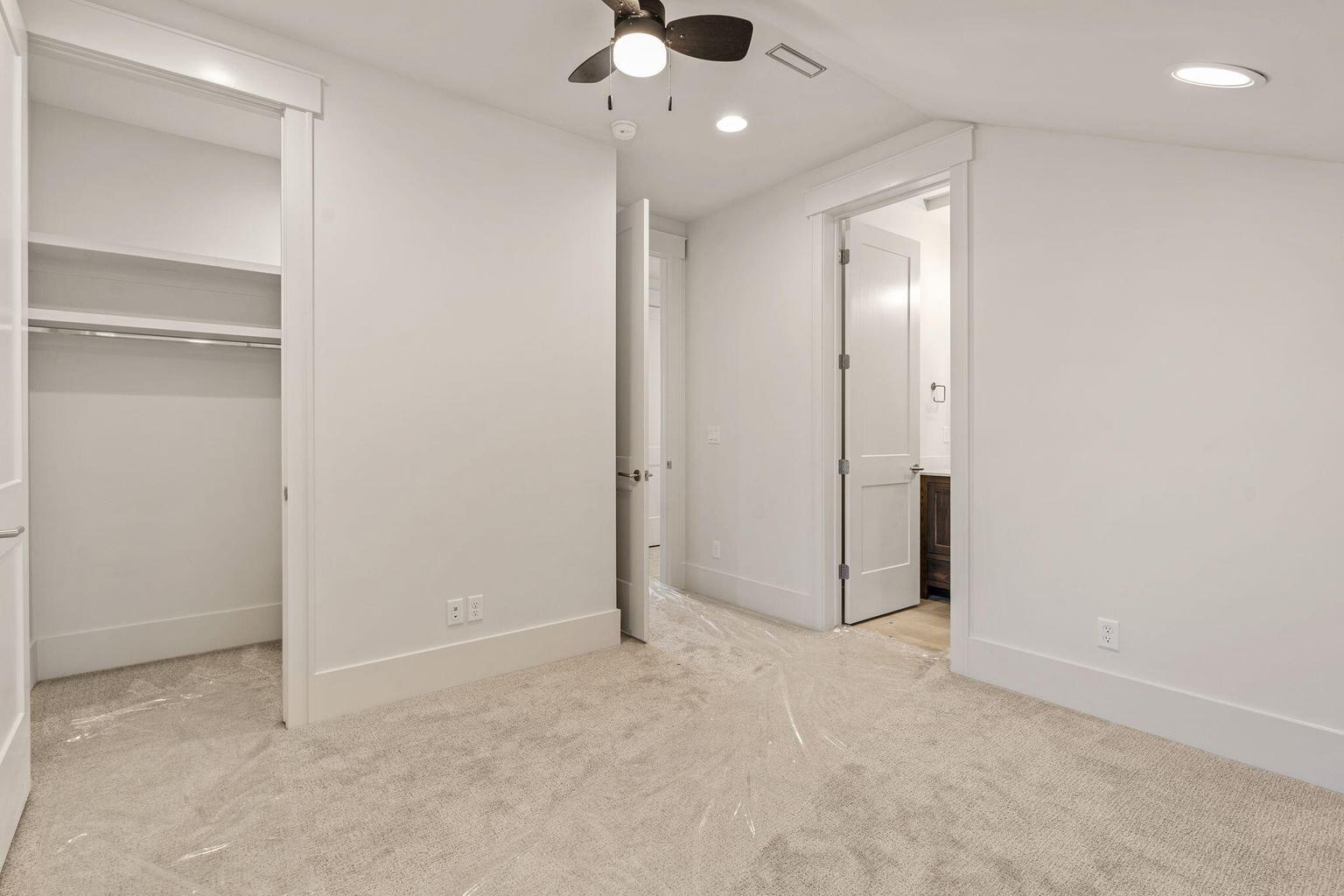 Room featuring plush carpet flooring, recessed lighting, and a ceiling fan