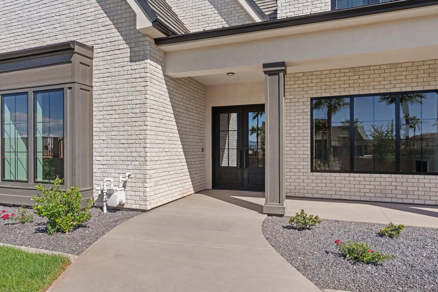 White brick exterior with dark trim accents