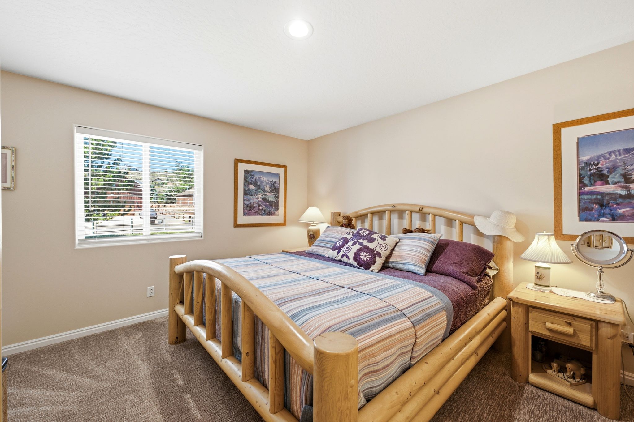 Warm-toned interior featuring a recessed ceiling light, light beige walls, and neutral carpet flooring