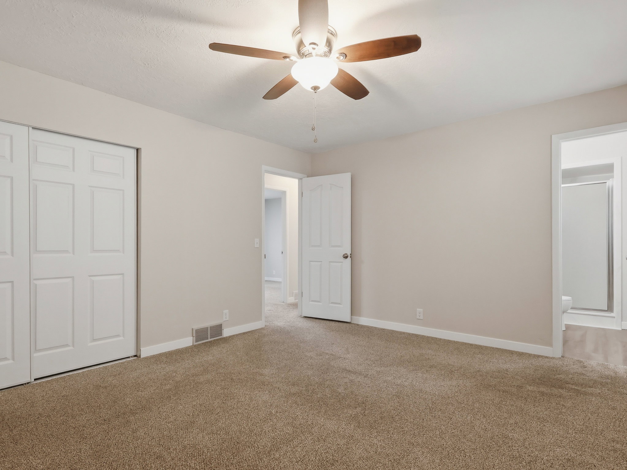 Neutral tone walls with coordinating carpet