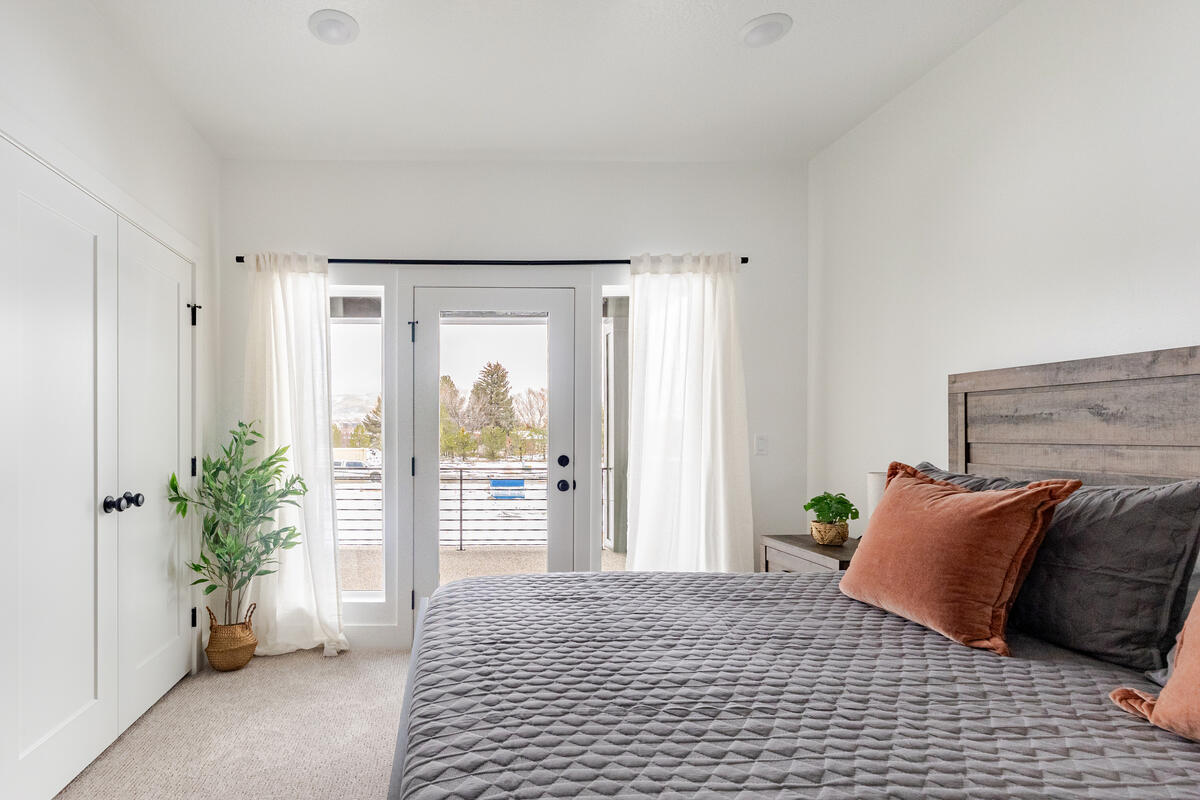 View from the entrance to 2nd large bedroom with king bed and private balcony/deck