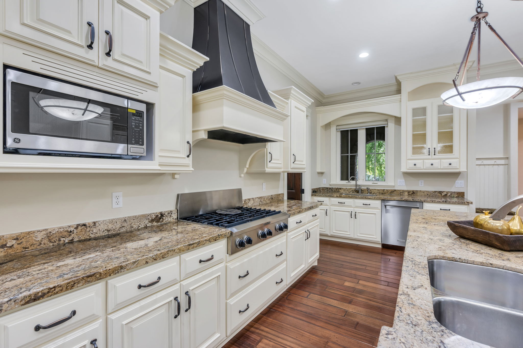 Kitchen with gas range and hood