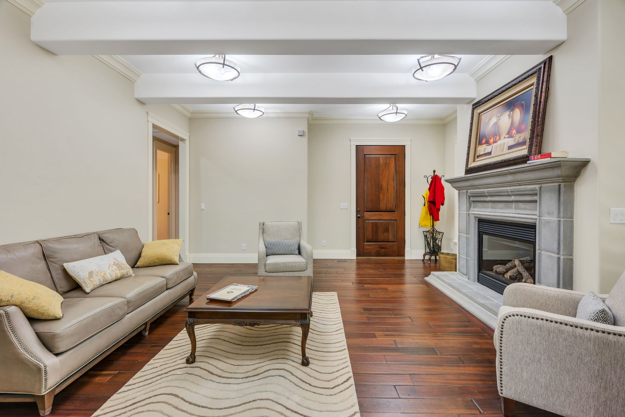 Living room with rich wood flooring and fireplace