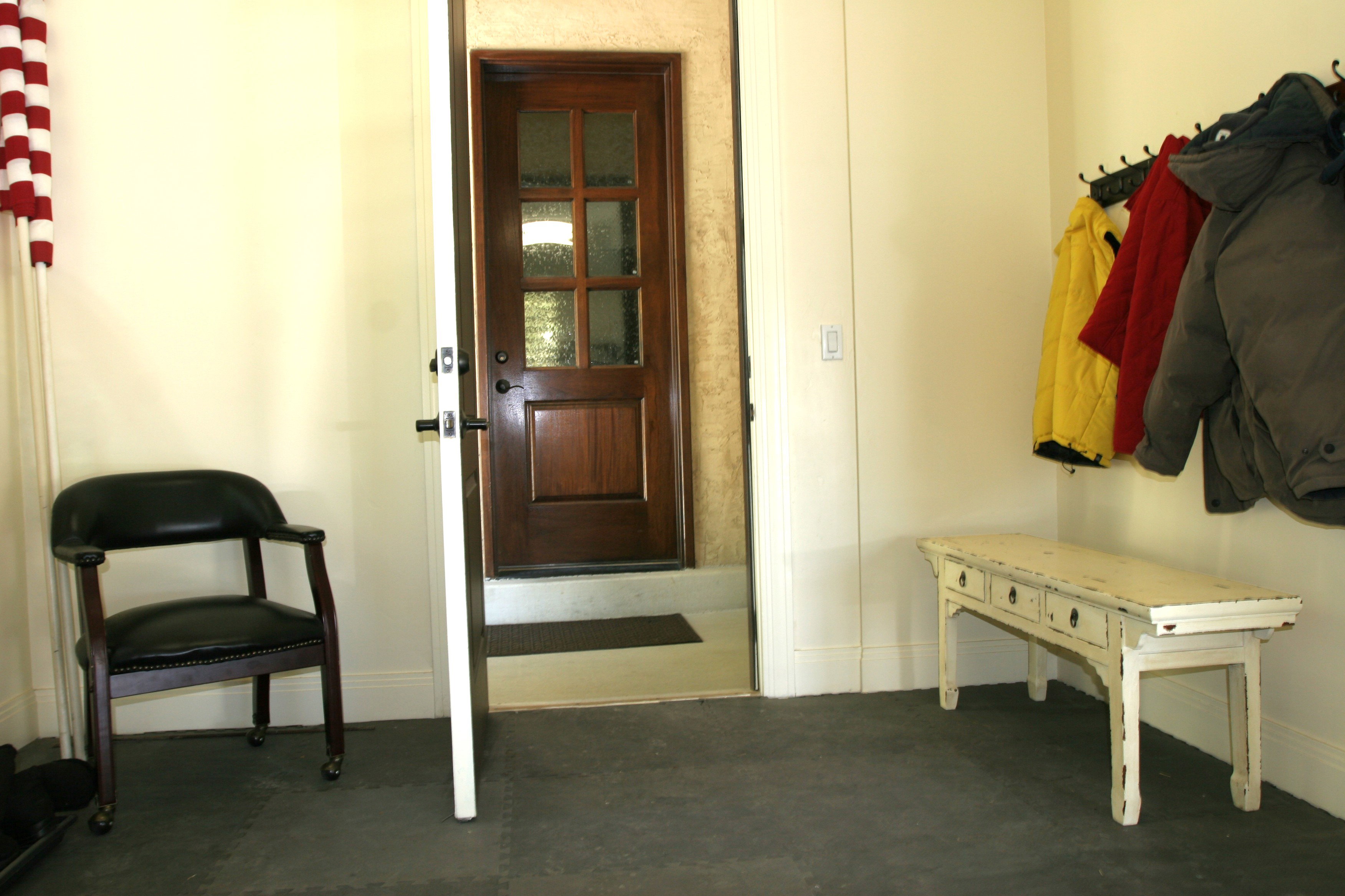 Mud area in garage from side door porch; also glass paneled door to home from side door porch