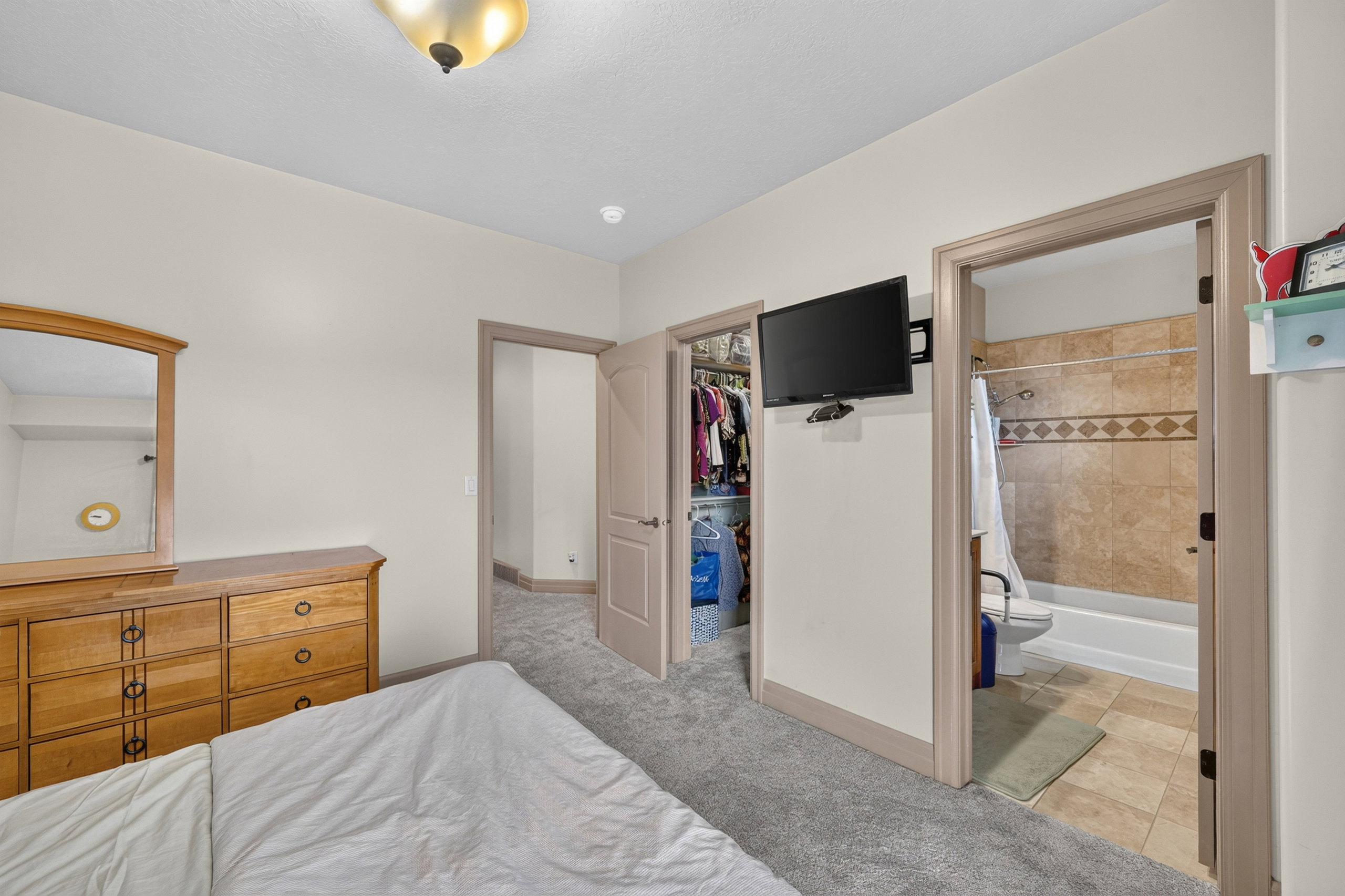 Carpeted interior space featuring neutral wall paint and trim