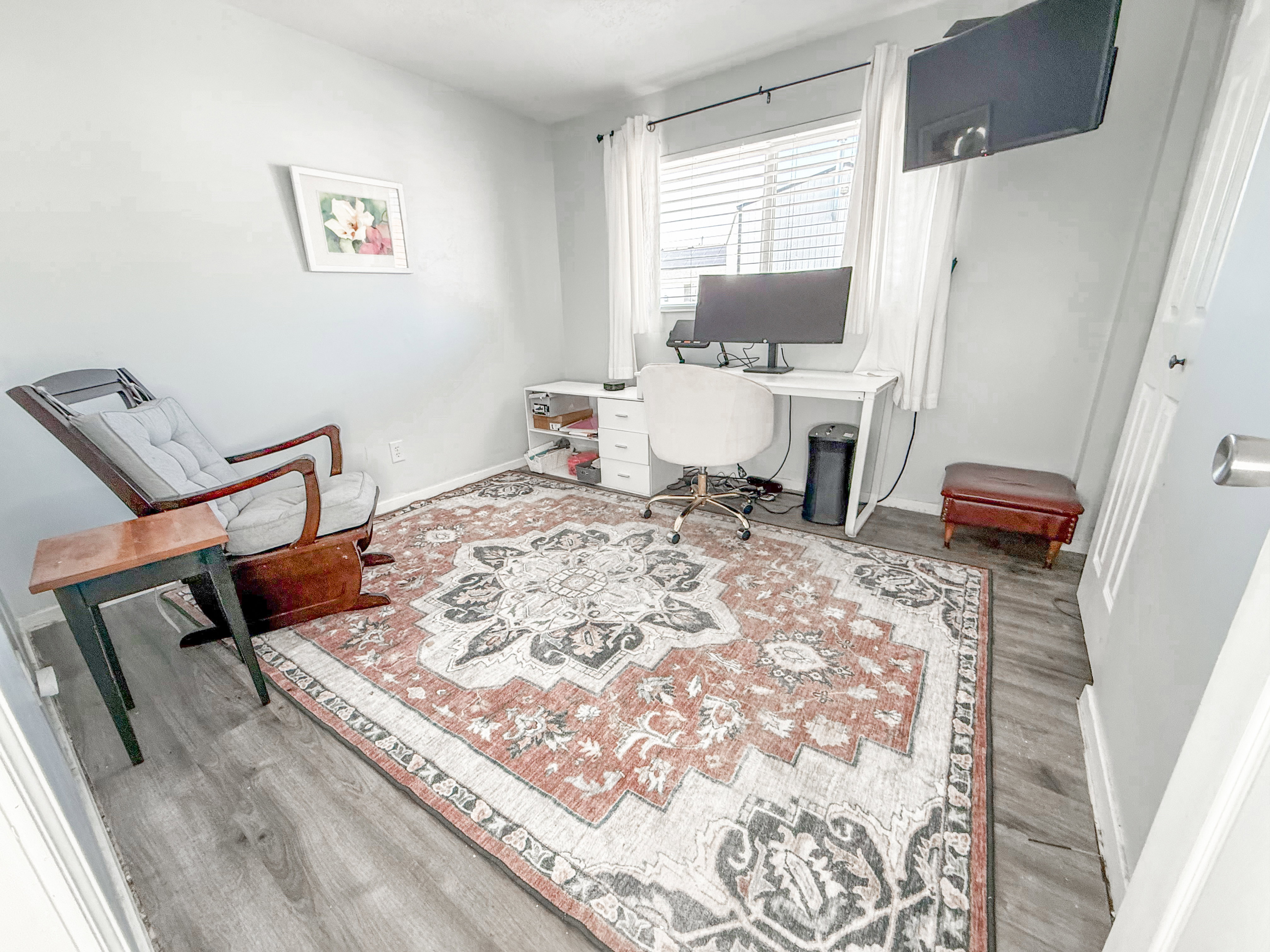 Office /bedroom, wood-finish flooring in this versatile room